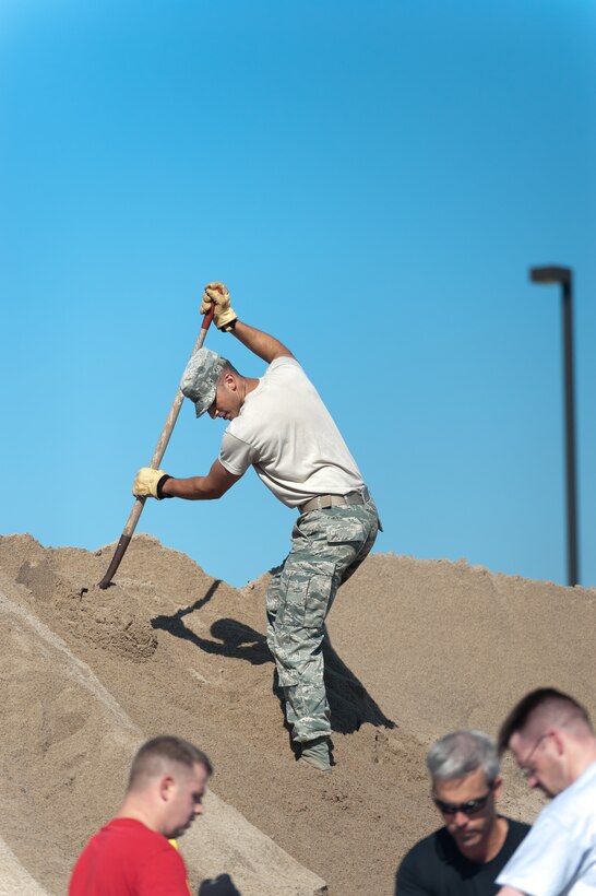 Military and civilian members of team Offutt and the local community shovel sand to fill bags in support of flood efforts in preparation of possible flooding in the near future at Offutt AFB and surrounding areas. For more information and reference links, see the <a href="http://www.stratcom.mil/flood_information/">USSTRATCOM Flood Information page.</a>