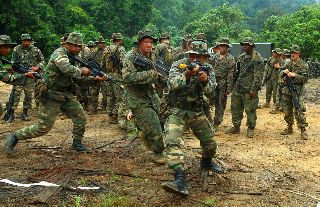 Malaysian Rangers with Company C, 8th Royal Ranger Regiment, Malaysian Army, and U.S. Marines with Landing Force Company conduct military operations on urban terrain training June 13. The training was part of Cooperation Afloat Readiness and Training (CARAT) 2011. CARAT is an annual series of bilateral exercises held between the U.S. and Southeast Asian nations with the goals of enhancing regional cooperation, promoting mutual trust and understanding, and increasing operational readiness throughout the participating nations.  While in Malaysia, U.S. and Malaysian service members trained together on jungle, urban and amphibious operations.