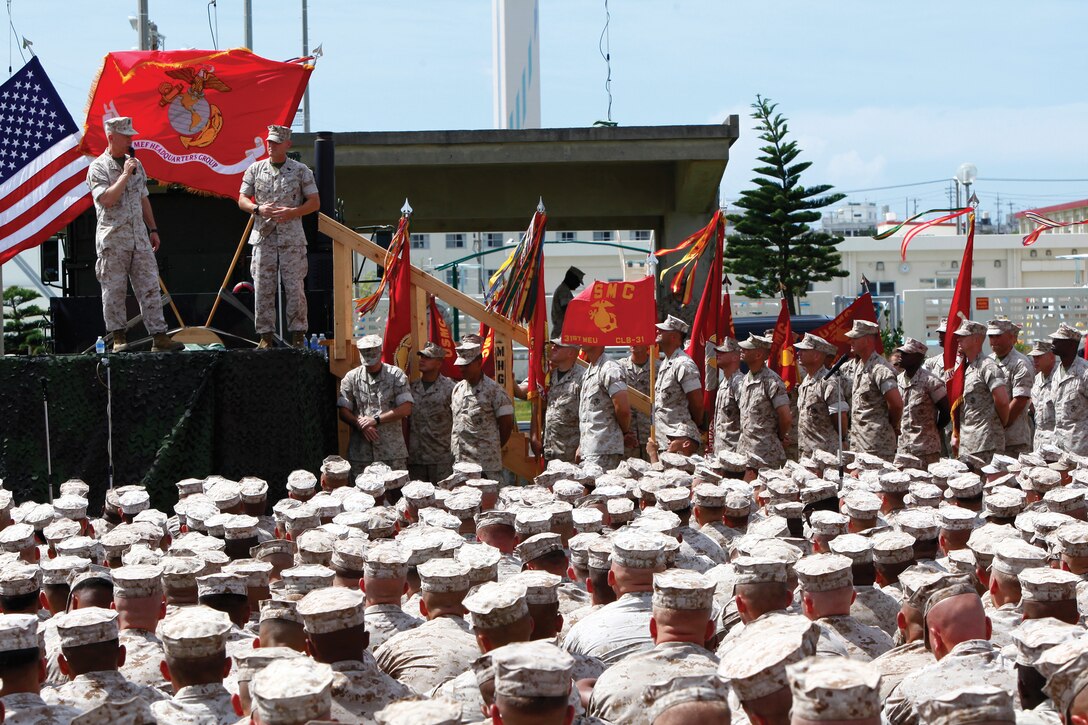 Gen. James F. Amos, the commandant of the Marine Corps, left, and Sgt. Maj. of the Marine Corps Michael P. Barrett, right, spoke with Marines on Camp Hansen, including Marines and sailors of the 31st Marine Expeditionary unit, about current events involving the Corps and its future, June 13. Both spoke about the progress being made in Afghanistan, the difference the Marines on Okinawa made during Operation Tomodachi and took time to answer questions from Marines.