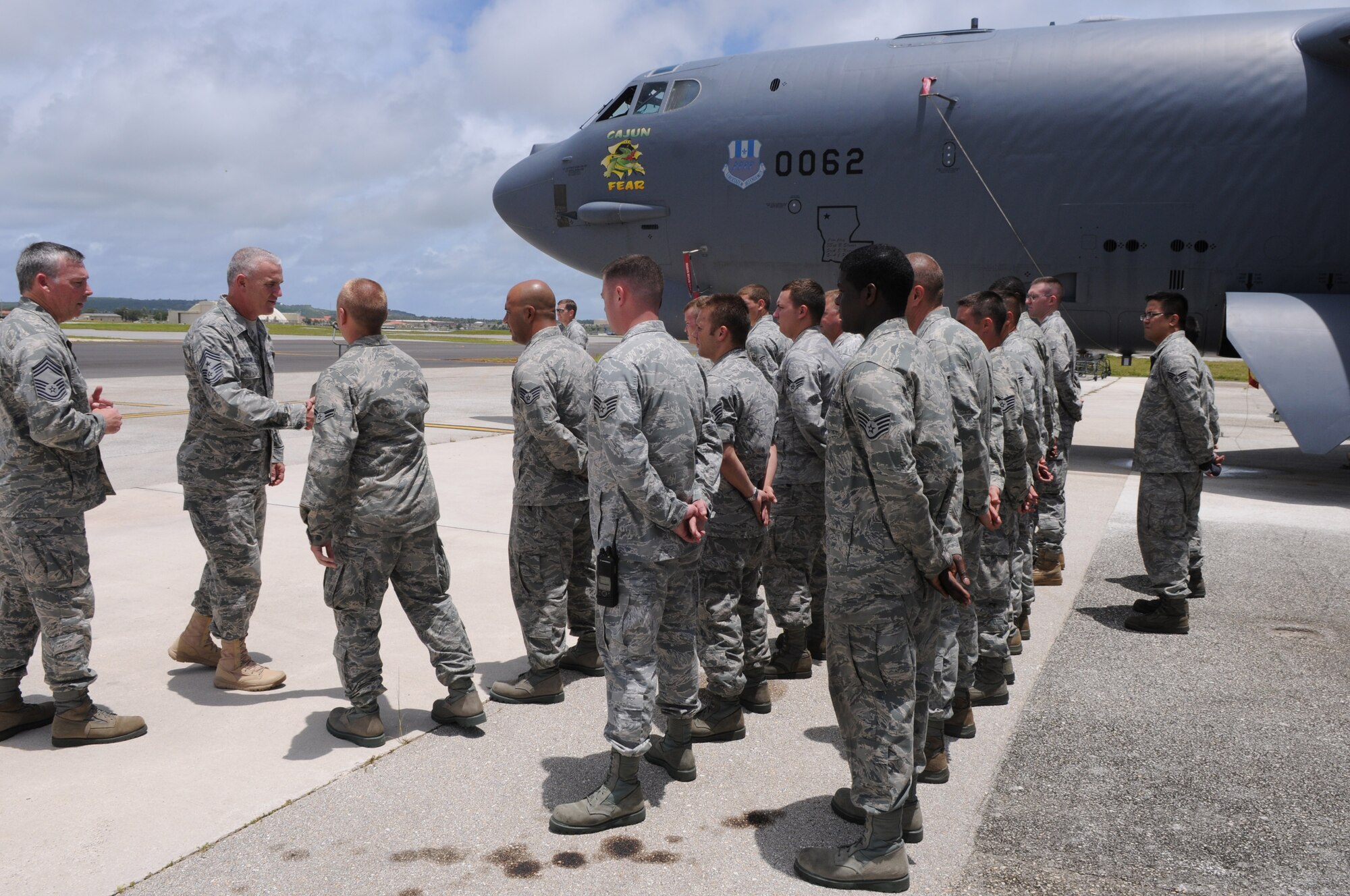 Chief Master Sgt. Brooke McLean, Pacific Air Forces command chief, meets with members of the 96th Expeditionary Bomb Squadron deployed in from Barksdale Air Force Base, Louisiana in support of Team Andersen's continuous bomber presence June 1. During the B-52 Stratofortress tour the chief was shown weapons bays and safety features on the aircraft. (U.S. Air Force photo/ Senior Airman Carlin Leslie)