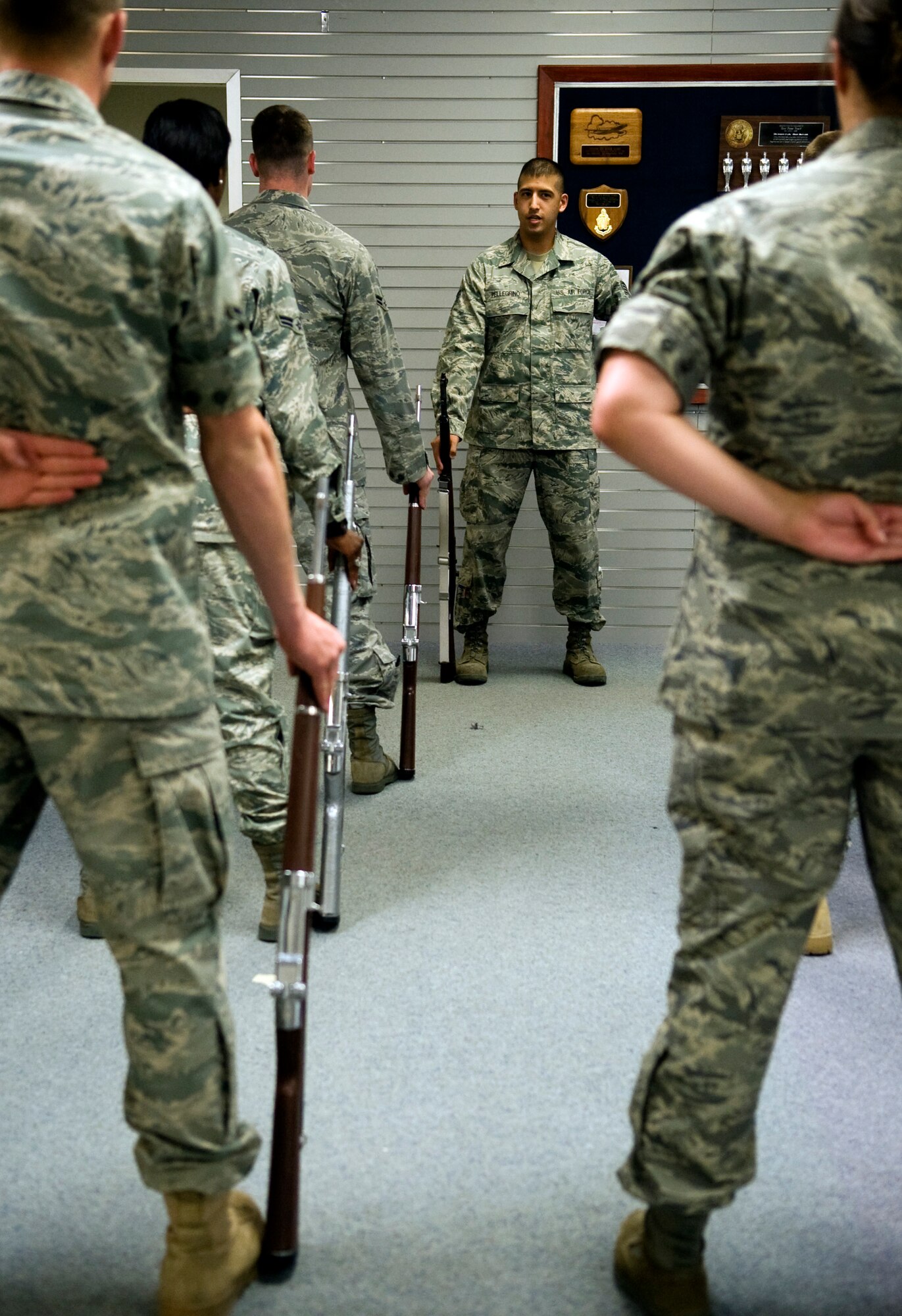 Staff Sgt. Kenny Pellegrino, honor guard training supervisor, reviews rifle movements during training June 7, 2011, Eielson Air Force Base, Alaska. Honor guard members are volunteers and their duties are carried out in addition to their regular duties. Sergeant Pellegrino is assigned to the 354th Maintenance Squadron. (U.S. Air Force photo/Airman 1st Class Laura Goodgame) 