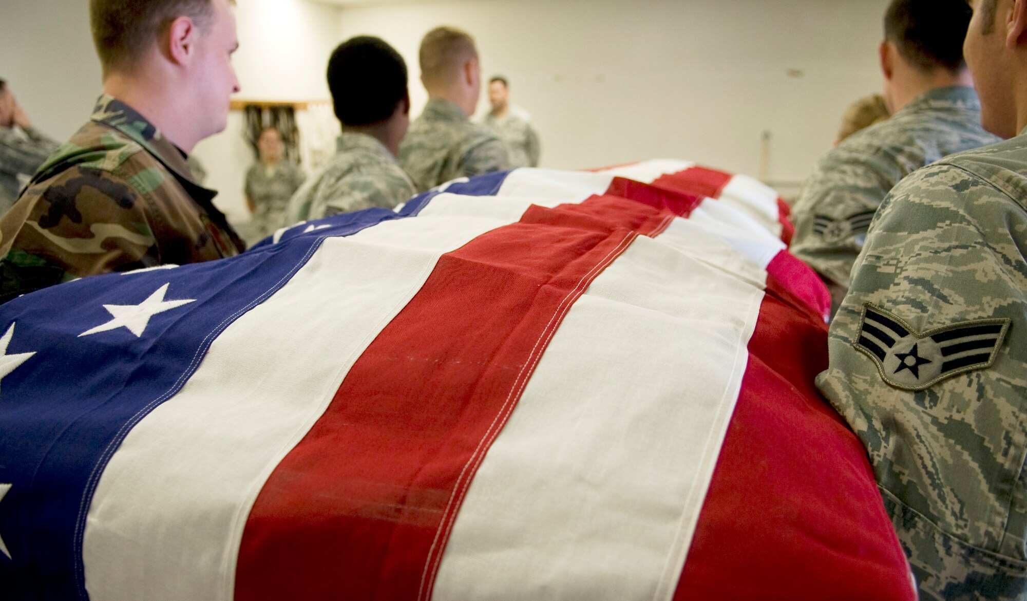 Eielson Honor Guardsmen carry a casket during a practice funeral ceremony June 7, 2011, Eielson Air Force Base, Alaska.  Honor Guard members drill constantly to maintain the precision they are known for. Their standards of flawlessness are set out of necessity to honor fallen Airmen.  (U.S. Air Force photo/Airman 1st Class Laura Goodgame) 