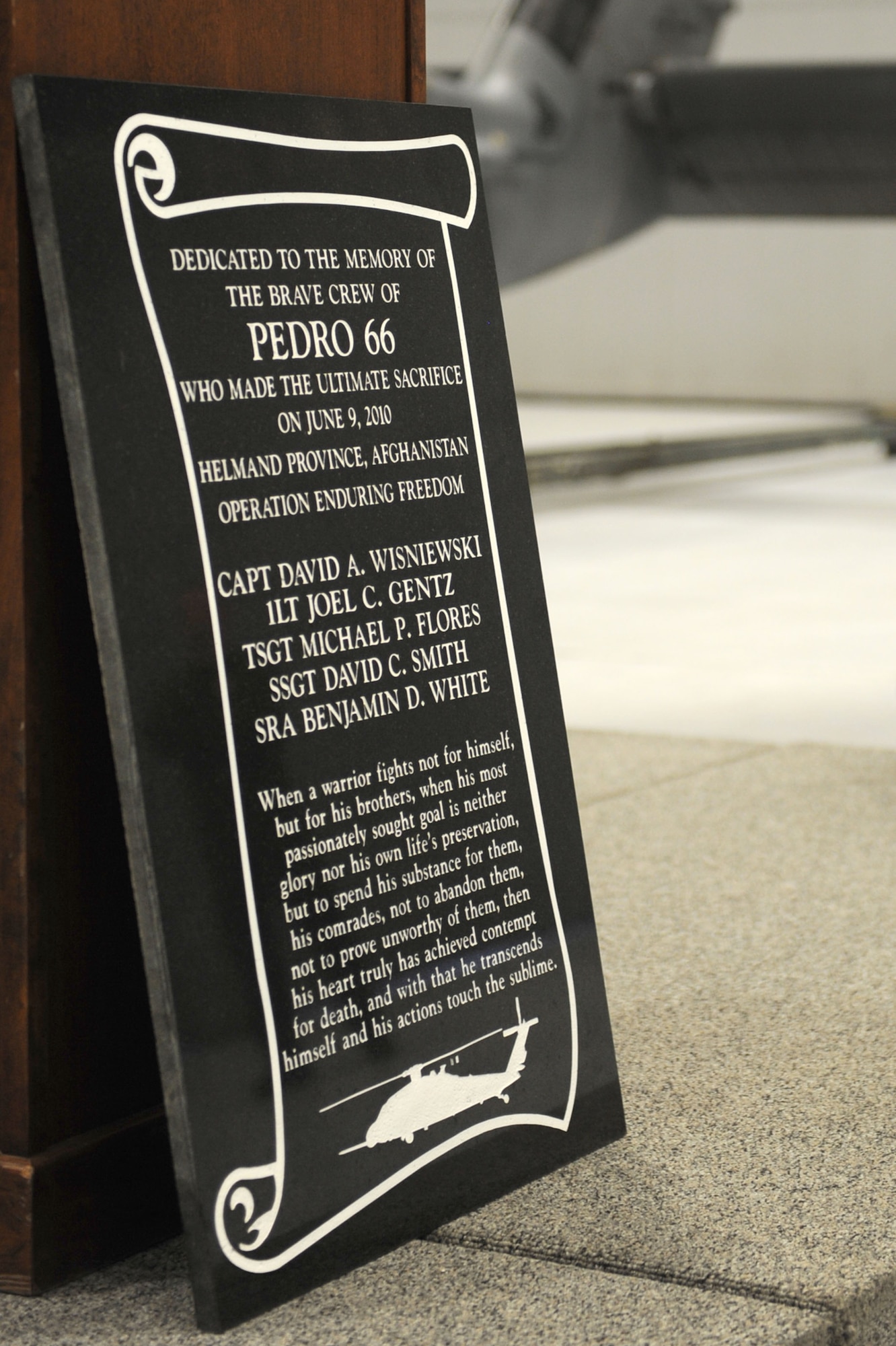 A plaque dedicated to the fallen crewmembers of an HH-60 Pave Hawk helicopter, call sign Pedro 66, was unveiled June 9, 2011, during a memorial ceremony at Nellis Air Force Base, Nev. The helicopter crashed in southwest Afghanistan June 9, 2010, during a rescue mission supporting Operation Enduring Freedom, killing five of the crew and critically injuring two. (U.S. Air Force photo/Staff Sgt. Taylor Worley)