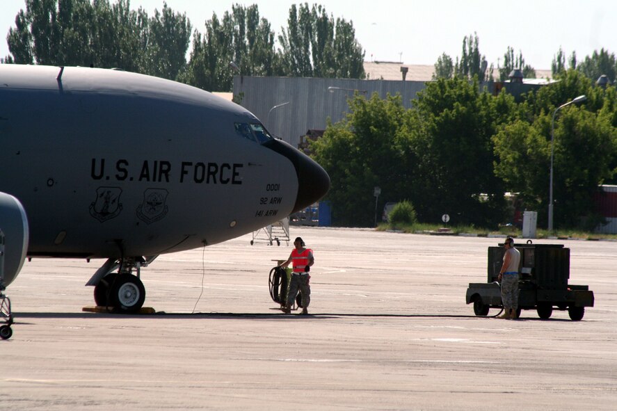 Aircraft maintenance Airmen assigned to the 376th Air Expeditionary Wing prepares KC-135R Stratotanker for a combat air refueling mission from the Transit Center at Manas, Kyrgyzstan, on June 7, 2011. The 376th AEW supports Operation Enduring Freedom and other operations in the U.S. Central Command area of responsibility. (U.S. Air Force Photo/Master Sgt. Scott T. Sturkol)