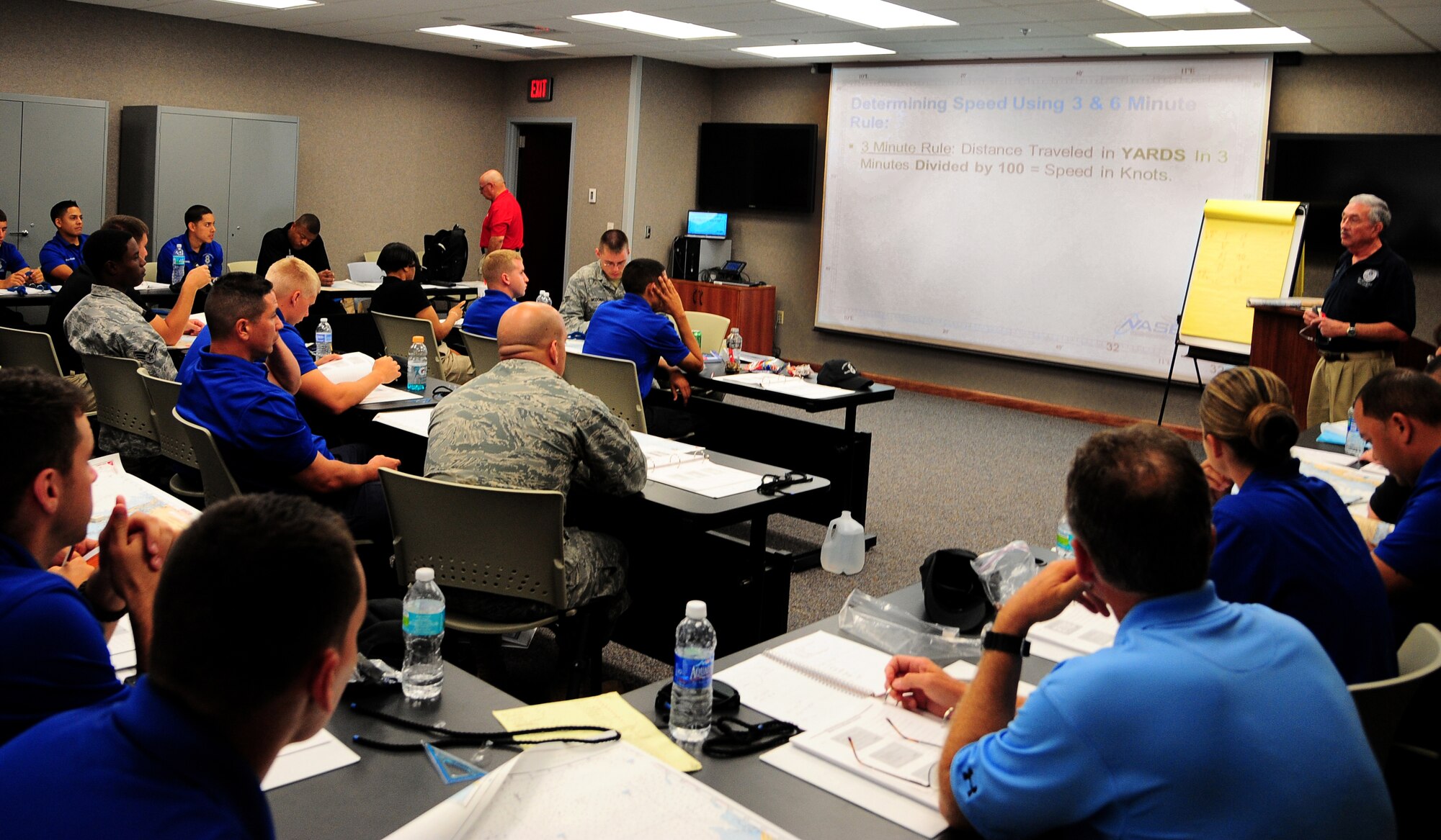 Mr. Melvin Manning, United States Coast Guard Auxiliary member, instructs marine patrol students during the National Association of State Boating Law Administrators Boat Operations and Training Program at the 6th Security Forces Squadron, MacDill Air Force Base, Fla., June 10 2011. The instruction was part of the NASBLA Boat Operations and Training Program. (U.S. Air Force photo by Airman Basic David Tracy)