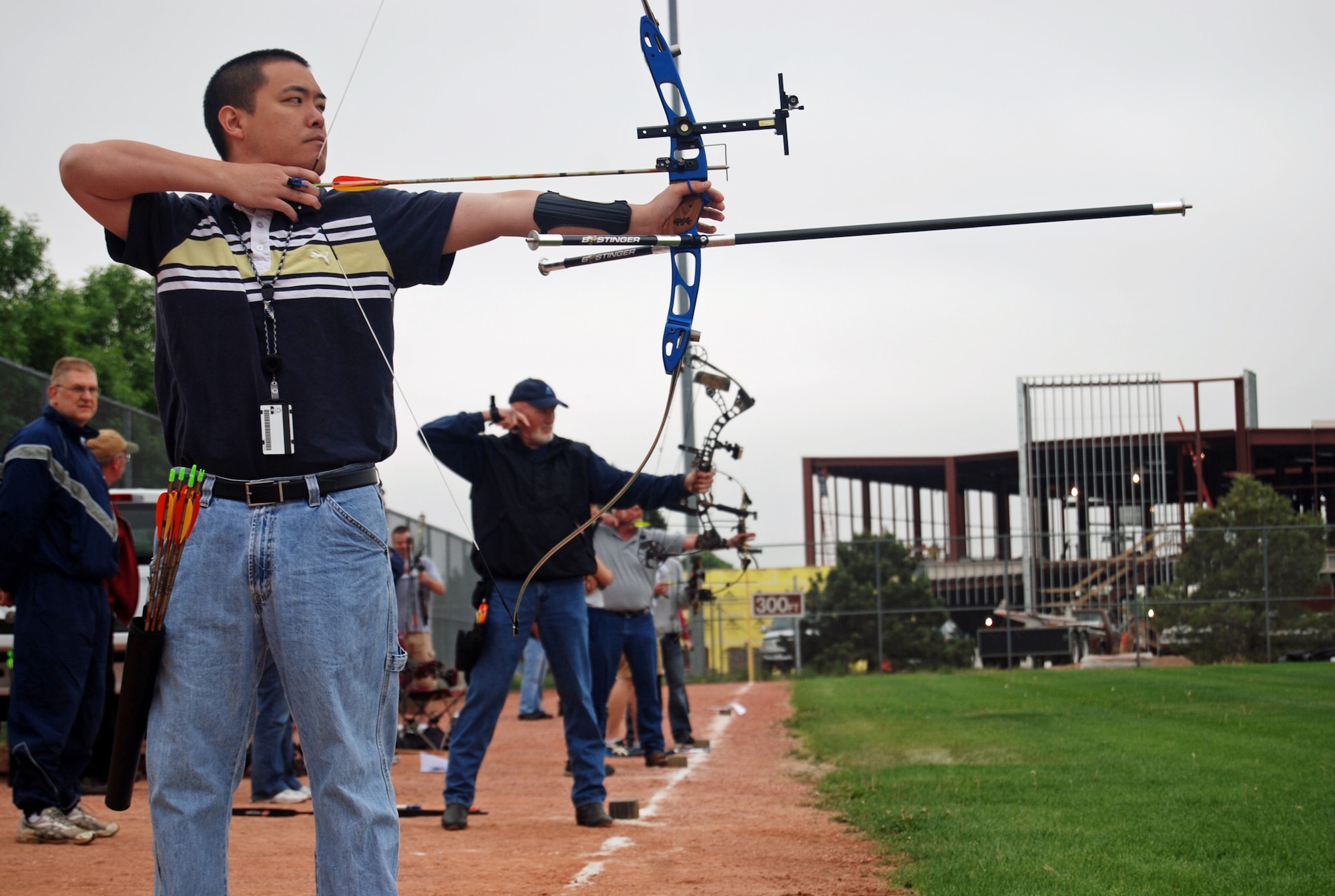 Scott Kawakami, Air Force Space Command Space and Missile Systems Center, prepares to take a shot from the 40 yard mark during the Sport and Field Day archery competition on Peterson Air Force Base June 9, 2011. The archery competition ended in a tie for first place between Maj. John Huckstep, Air Force Space Command Plans and Programs, and Staff Sgt. Christopher McDonald, 21st Civil Engineer Squadron unit safety representative, each garnering 261 out of 300 possible points. (U.S. Air Force photo/Airman 1st Class Jessica Hines)