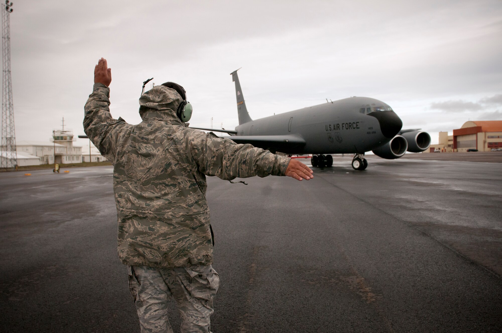 KEFLAVIK, Iceland -- Master Sgt. Lionel Washington, 459th Aircraft Maintenance Squadron crew chief and team leader marshalls a KC-135 Stratotanker from the 459th Air Refueling Wing for takeoff during the 2011 Northern Viking exercise here June 8. Northern Viking tests the capabilities of Iceland and the country's NATO allies, as well as "increase the readiness of the forces involved and their interoperability." The Reserve 459th ARW, Joint Base Andrews, Md., participated in this year's exercise along with other Air Force active-duty and Air National Guard wings. (U.S. Air Force photo released/Tech. Sgt. Steve Lewis)