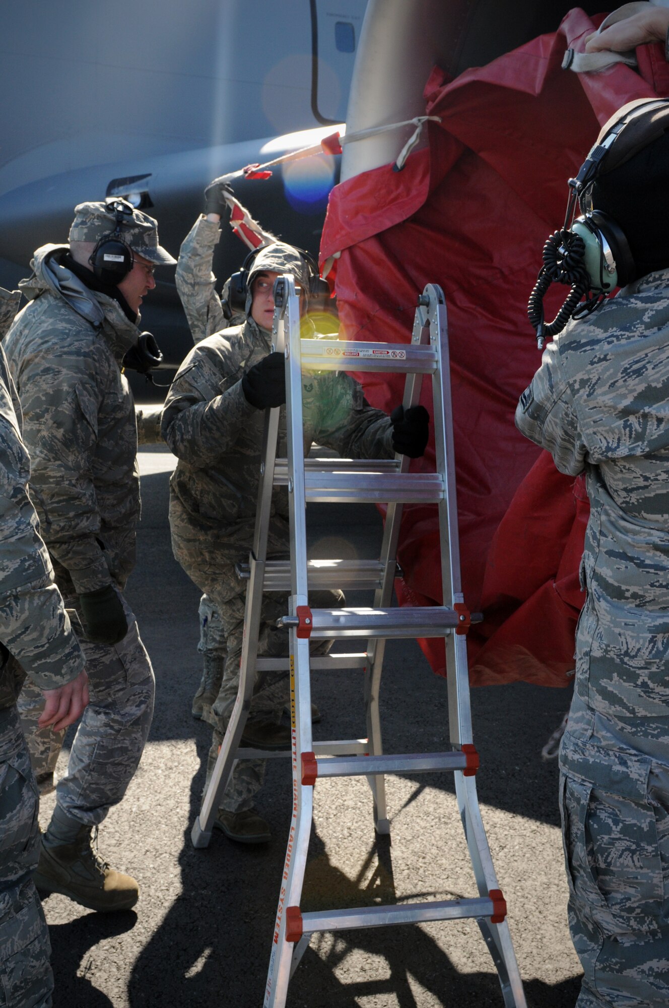 KEFLAVIK, Iceland -- 459th Aircraft Maintenance Squadron specialists apply engine covers on a KC-135 Stratotanker from the 459th Air Refueling Wing shortly after landing during the 2011 Northern Viking exercise here June 8. Northern Viking tests the capabilities of Iceland and the country's NATO allies, as well as "increase the readiness of the forces involved and their interoperability." The Reserve 459th ARW, Joint Base Andrews, Md., participated in this year's exercise along with other Air Force active-duty and Air National Guard wings. (U.S. Air Force photo released/Tech. Sgt. Steve Lewis)