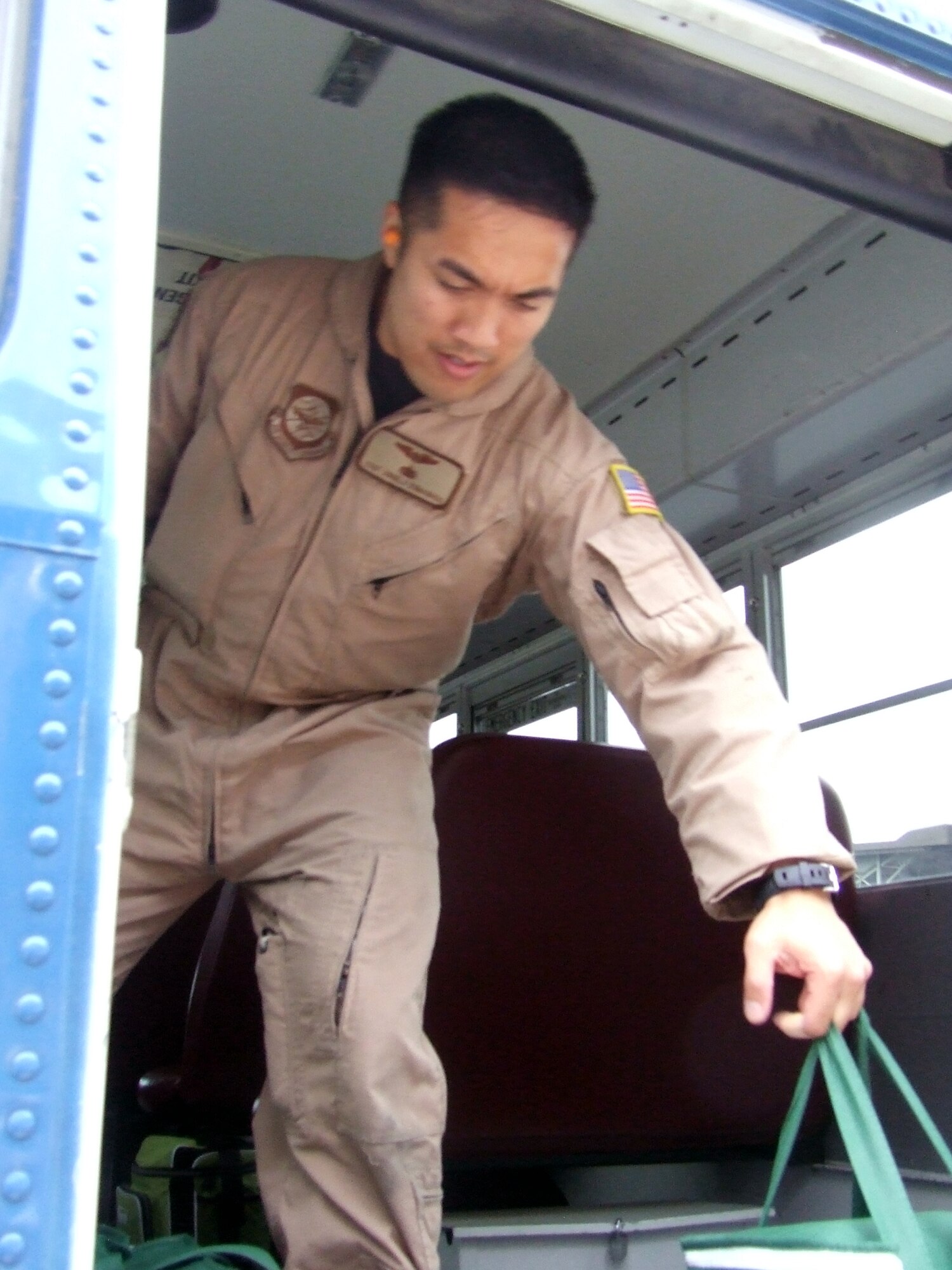 Staff Sgt. Angelo Dumanhog, C-5 Galaxy loadmaster, works in a C-5M Super Galaxy on June 5, 2011, prior to departing for a direct delivery airlift mission through the Arctic Circle from Dover Air Force Base, Del., to Bagram Airfield, Afghanistan. Sergeant Dumanhog was one of 14 crewmembers who flew the mission. He is from the 9th Airlift Squadron at Dover AFB.  (U.S. Air Force Photo/Master Sgt. Scott T. Sturkol)