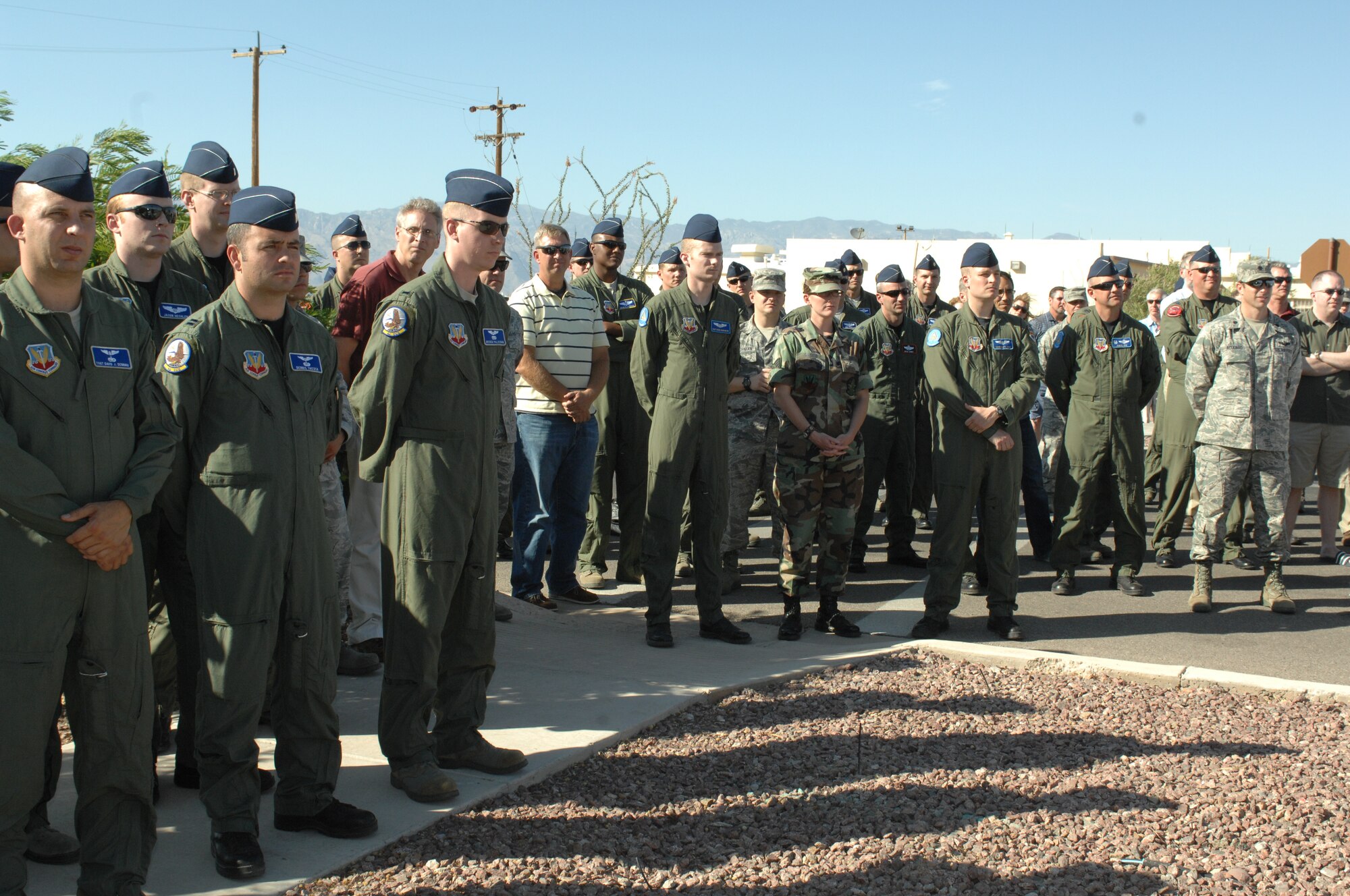 Members of the 55th Electronic Combat Group attend the Heritage Wall unveiling ceremony here June 2.