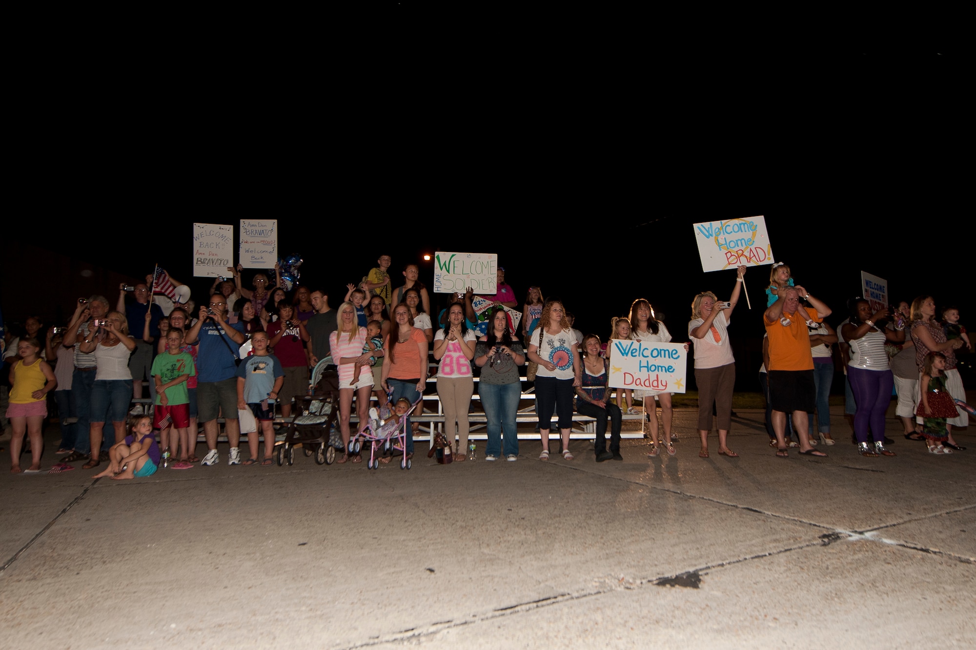 Friends and family members at Moody Air Force Base, Ga., cheer and shout as Airmen from the 824th Base Defense Squadron return home from a six-month deployment June 11, 2011. The 824th BDS had more than 100 Airmen return home from Afghanistan. (U.S. Air Force photo by Airman 1st Class Joshua Green/Released)
