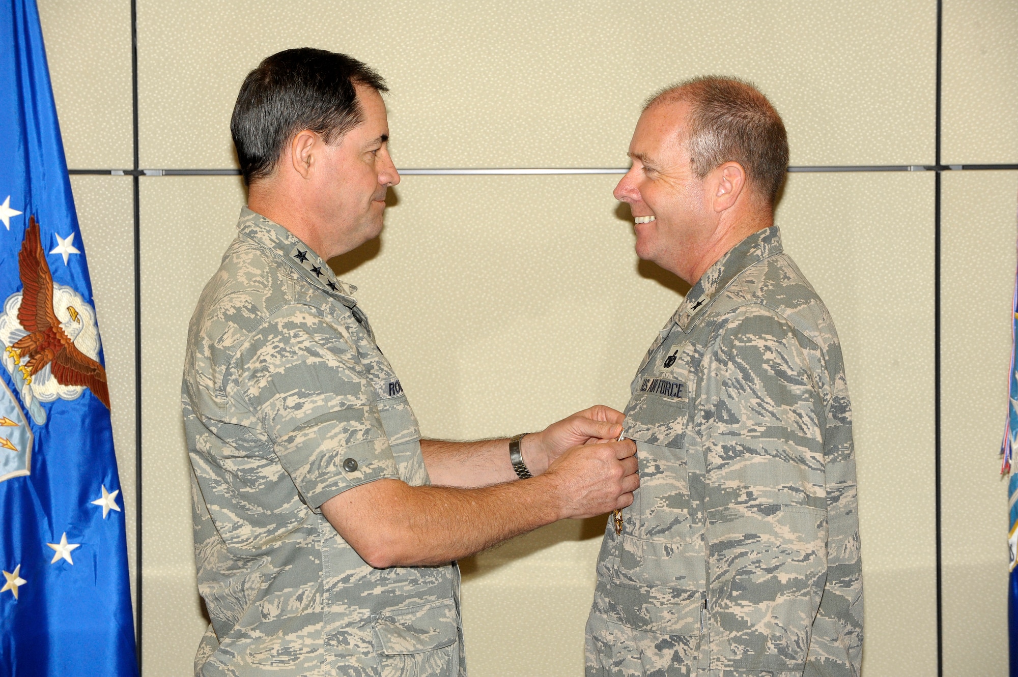 Lt. Gen. Marc E. Rogers, The Inspector General for the Air Force, pins the Legion of Merit Medal on Brig. Gen. Kevin Jacobsen, Air Force Office of Special Investigations commander June 9. General Jacobsen received the award for his work as the director of the Special Investigations Directorate in Washington, D.C. (U.S. Air Force photo by Mr. Mike Hastings.)