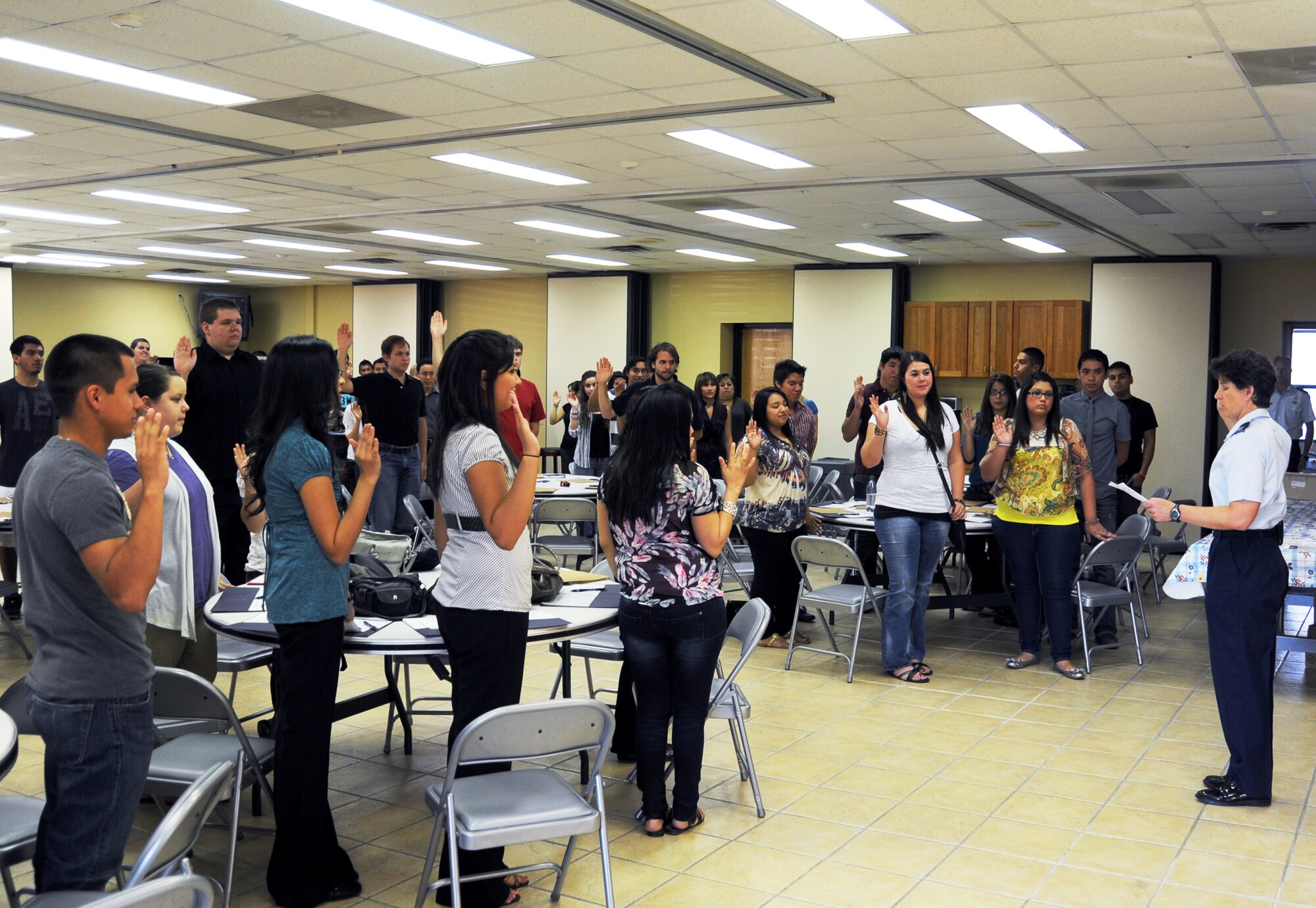 LAUGHLIN AIR FORCE BASE, Texas -- Students involved in Laughlin’s 2011 summer hire program take an oath with Col. Angela Cadwell, 47th Mission Support Group commander, at Laughlin’s Wing Chapel June 6. Eighty seven local students will be employed at Laughlin by taking part in the 10-week program assisting various base organizations. (U.S. Air Force photo by Jose Mendoza)