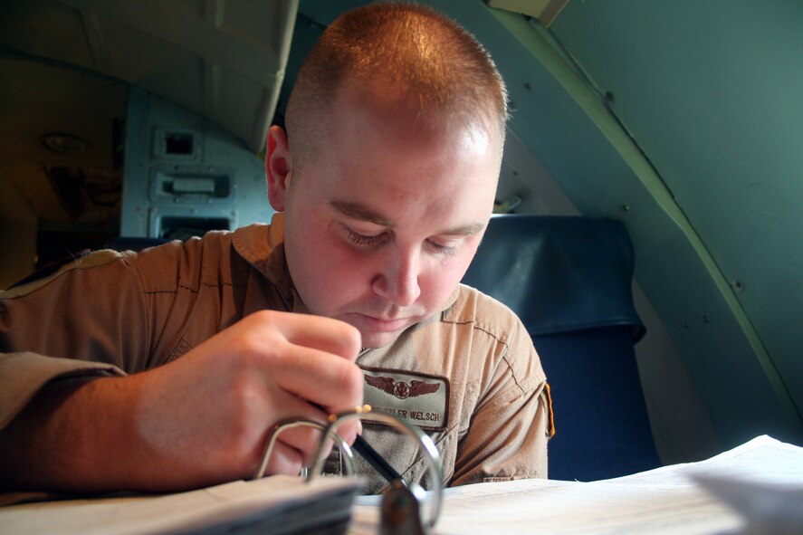 Staff Sgt. Tyler Welsch, C-5 Galaxy flight engineer, works in a C-5M Super Galaxy on June 5, 2011, prior to departing for a direct delivery airlift mission through the Arctic Circle from Dover Air Force Base, Del., to Bagram Airfield, Afghanistan. Sergeant Welsch was one of 14 crewmembers who flew the mission. He is from the 9th Airlift Squadron at Dover AFB.  (U.S. Air Force Photo/Master Sgt. Scott T. Sturkol)