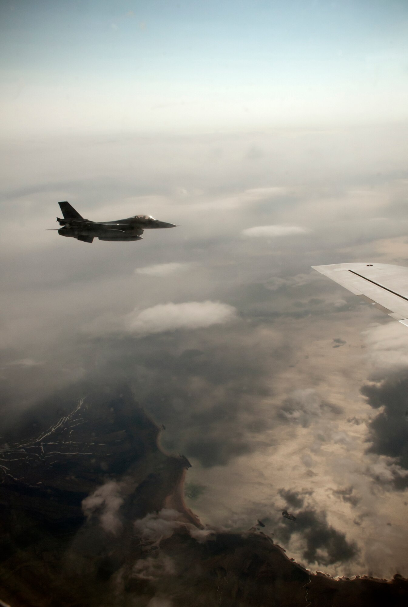 KEFLAVIK, Iceland -- A Royal Norwegian Air Force F-16 flies off the wing of a 459th Air Refueling Wing KC-135 Stratotanker waiting to receive fuel during the Northern Viking 2011 exercise here June 9. Northern Viking tests the capabilities of Iceland and the country's NATO allies, as well as "increase the readiness of the forces involved and their interoperability." The Air Force Reserve 459th ARW, Joint Base Andrews, Md., participated in this year's exercise along with other active-duty and Air National Guard units. (U.S. Air Force photo released/Tech. Sgt. Steve Lewis)