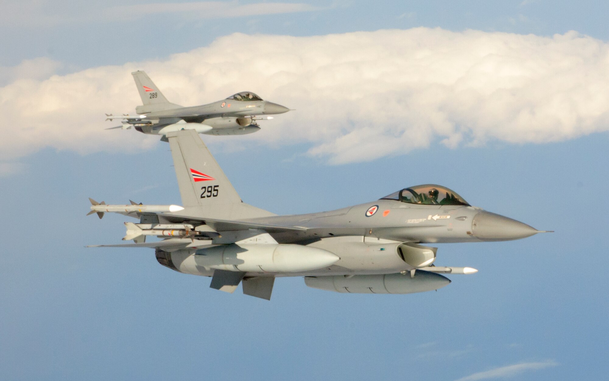 KEFLAVIK, Iceland -- Royal Norwegian Air Force F-16s fly off the wing of a 459th Air Refueling Wing KC-135 Stratotanker awaiting to receive fuel during Northern Viking 2011 here June 8. Northern Viking tests the capabilities of Iceland and the country's NATO allies, as well as "increase the readiness of the forces involved and their interoperability." The Reserve 459th Air Refueling Wing, Joint Base Andrews, Md., participated in this year's exercise along with other active-duty and Air National Guard units. (U.S. Air Force photo released/Tech. Sgt. Steve Lewis)