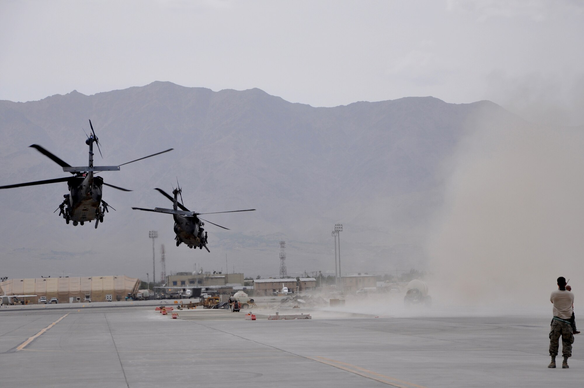 Two HH-60G Pave Hawk helicopters take off June 11, 2011, from Bagram Airfield, Afghanistan. (U.S. Air Force photo/Staff Sgt. John Wright)