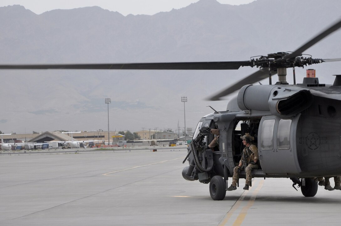 An HH-60G Pave Hawk helicopter pilot and pararescueman prepare for takeoff June 11, 2011, at Bagram Airfield, Afghanistan. (U.S. Air Force photo/Staff Sgt. John Wright)