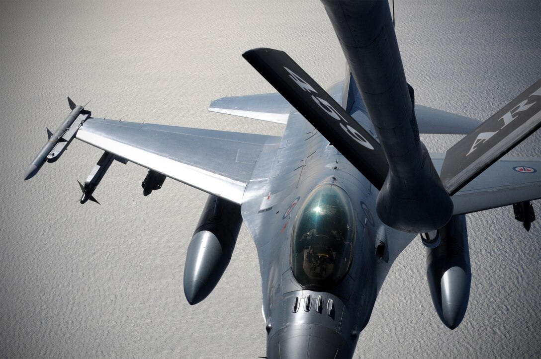 KEFLAVIK, Iceland -- Staff Sgt. Dana Fernkas, 756th Air Refueling Squadron, refuels a Royal Norwegian Air Force F-16 during the 2011 Northern Viking exercise here June 7. Northern Viking tests the capabilities of Iceland and the country's NATO allies, as well as "increase the readiness of the forces involved and their interoperability." The Reserve 459th Air Refueling Wing, Joint Base Andrews, Md., participated in this year's exercise along with other Air Force active-duty and Air National Guard wings. (U.S. Air Force photo released/Tech. Sgt. Steve Lewis)