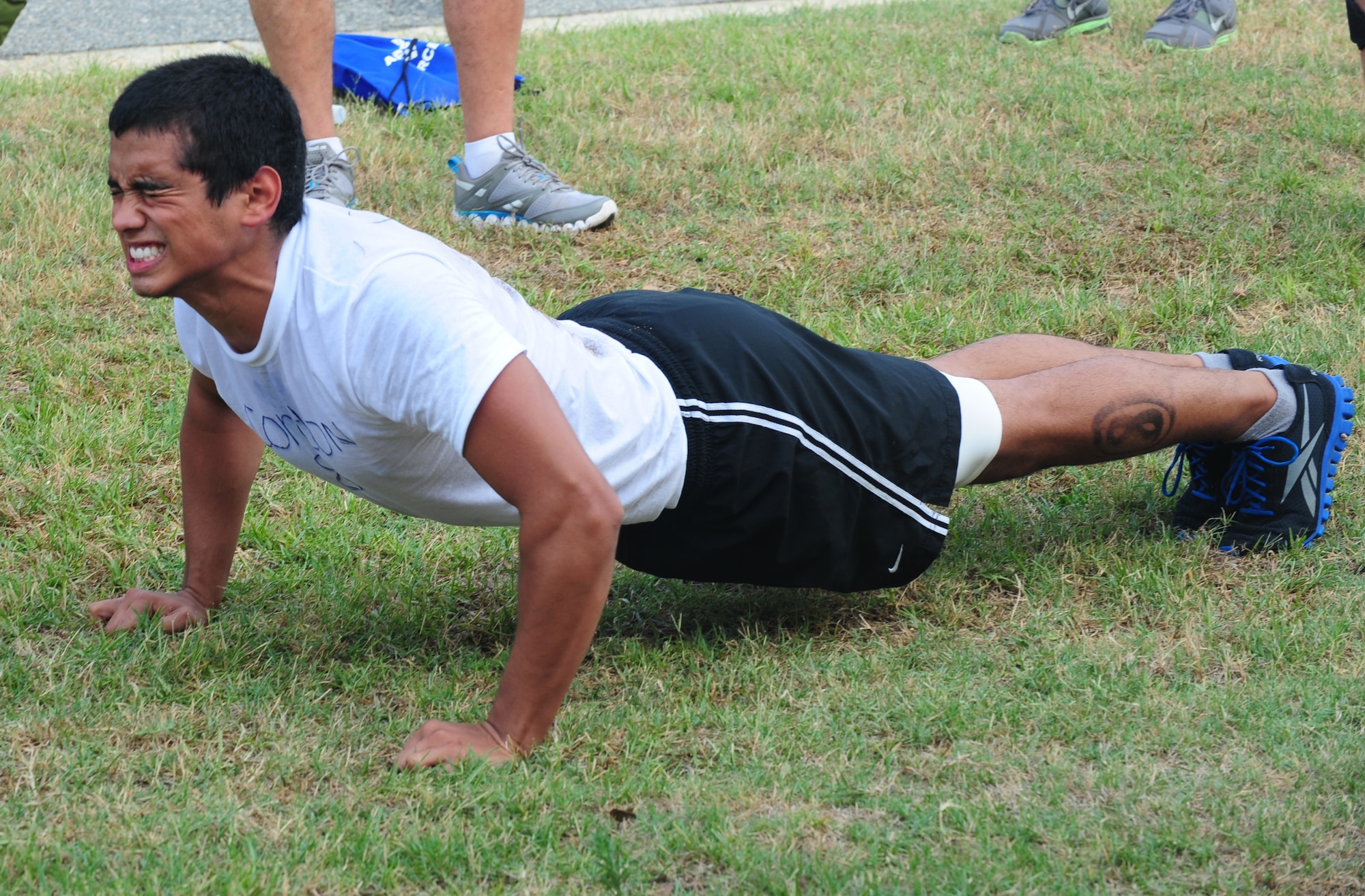U.S. Air Force recruit Franklin Cordon gives his final effort toward the end of the push-up portion the physical ability and stamina test during Battlefield Airman Camp at Moody Air Force Base, Ga., June 10, 2011. The PAST is one segment of the BAC, a program designed to prepare Airman for upcoming special operations schools.  (U.S. Air Force photo by Senior Airman Stephanie Mancha/Released)