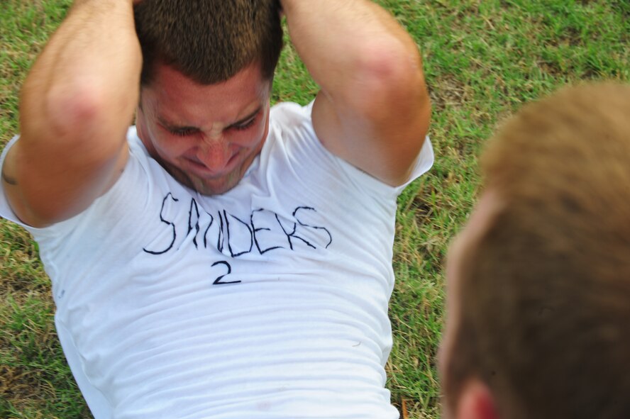 U.S. Air Force recruit Benjamin Sanders performs the sit-up portion of the physical ability and stamina test during Battlefield Airman Camp at Moody Air Force Base, Ga., June 10, 2011. Sanders said he felt the camp helped him prepare for the environment of the Pararescue Indoctrination Course which he is scheduled to begin in July. (U.S. Air Force photo by Senior Airman Stephanie Mancha/Released)