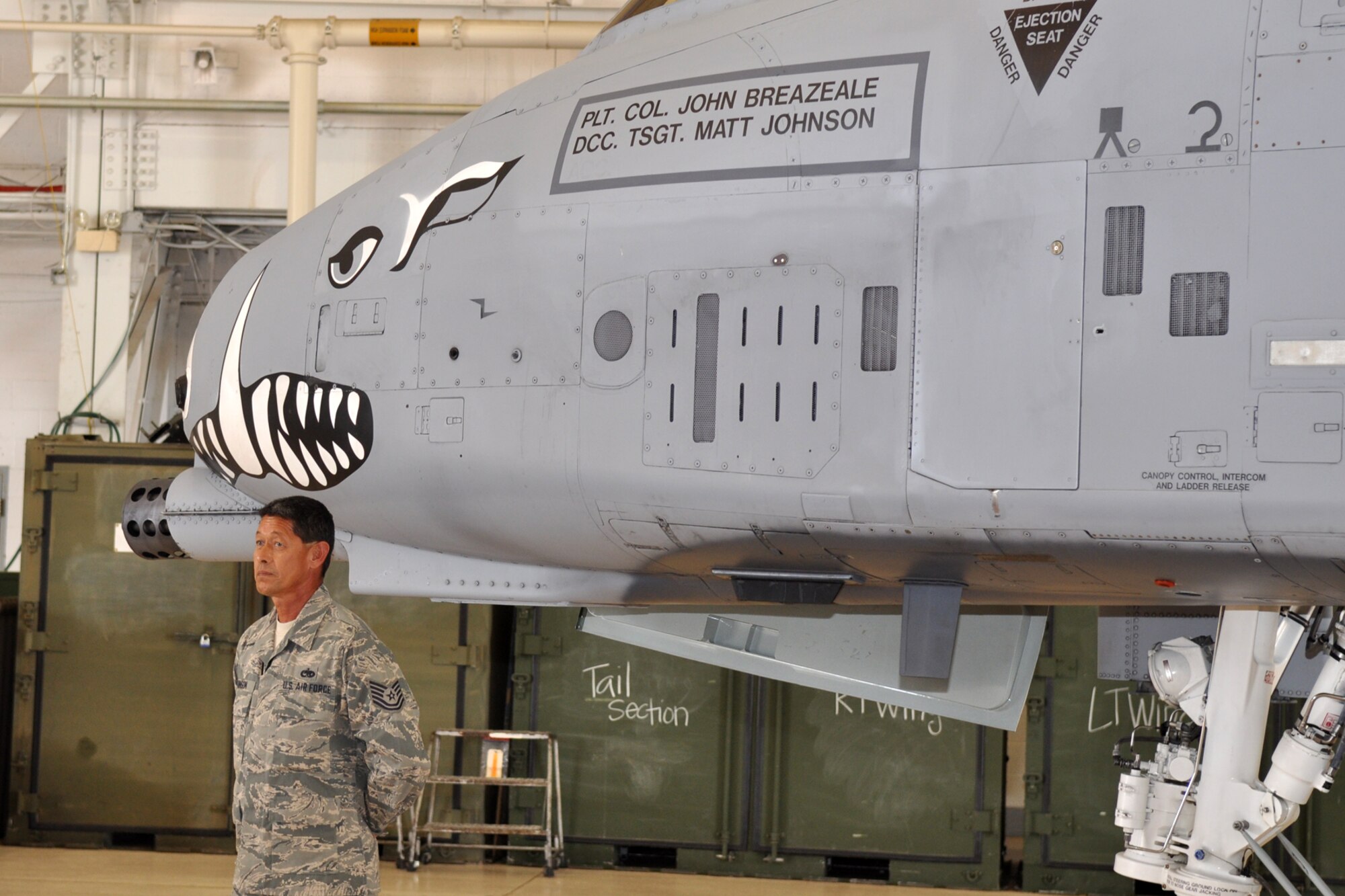 Tech. Sgt. Matthew Johnson, crew chief, 717th Aircraft Maintenance Squadron, stands by after the revealing of the commander’s aircraft during promotion and assumption of command ceremonies held Friday, June 10, 2011, in the A-10 hangar at Barksdale Air Force Base, La. Colonel John Breazeale assumed command of the 917th Fighter Group at Barksdale AFB. Approximately 70 family members, friends and civic leaders were in attendance for the event. (U.S. Air Force photo/Tech. Sgt. Jeff Walston)