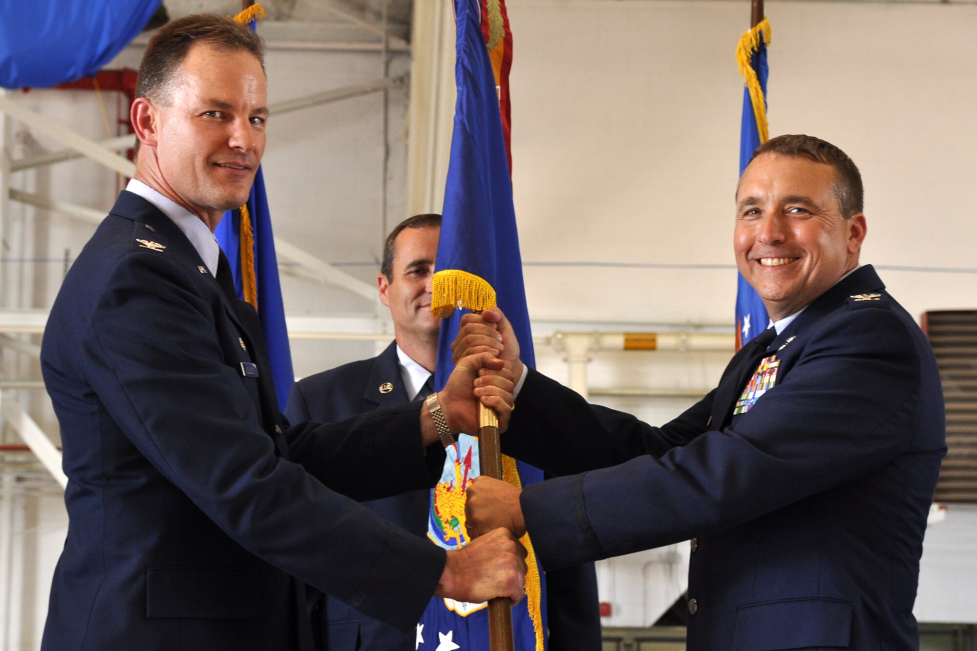 With the passing of the guidon from Colonel Eric Overturf, commander, 442nd Fighter Wing, Whiteman Air Force Base, Mo., Colonel John Breazeale, assumes command of the 917th Fighter Group during an assumption of command ceremony held Friday, June 10, 2011, in the A-10 hangar at Barksdale Air Force Base, La. Approximately 70 family members, friends and civic leaders were in attendance for the event. (U.S. Air Force photo/Tech. Sgt. Jeff Walston)