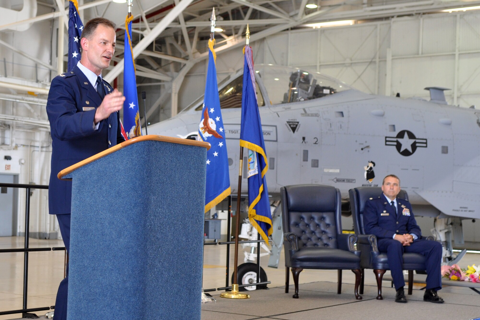 Colonel Eric Overturf, commander, 442nd Fighter Wing, Whiteman Air Force Base, Mo., praises both Lt. Col. James Macaulay, deputy commander, 917th Fighter Group, and Lt. Col. John Breazeale, during an assumption of command ceremony held Friday, June 10, 2011, in the A-10 hangar at Barksdale Air Force Base, La. Colonel Breazeale took the reins as the new commander of the 917th FG. (U.S. Air Force photo/Tech. Sgt. Jeff Walston)