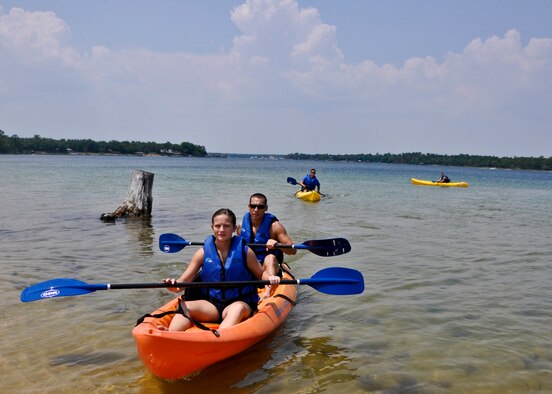 Kayak enthusiasts return from a water trip at the Team Eglin Picnic at Post’l Point June 10.  Eglin personnel and their families enjoyed an afternoon complete with food, beverages and activities, including a water slide, bouncy house, climbing wall, face painting and horseback riding. (U.S. Air Force photo/Kevin Gaddie)
