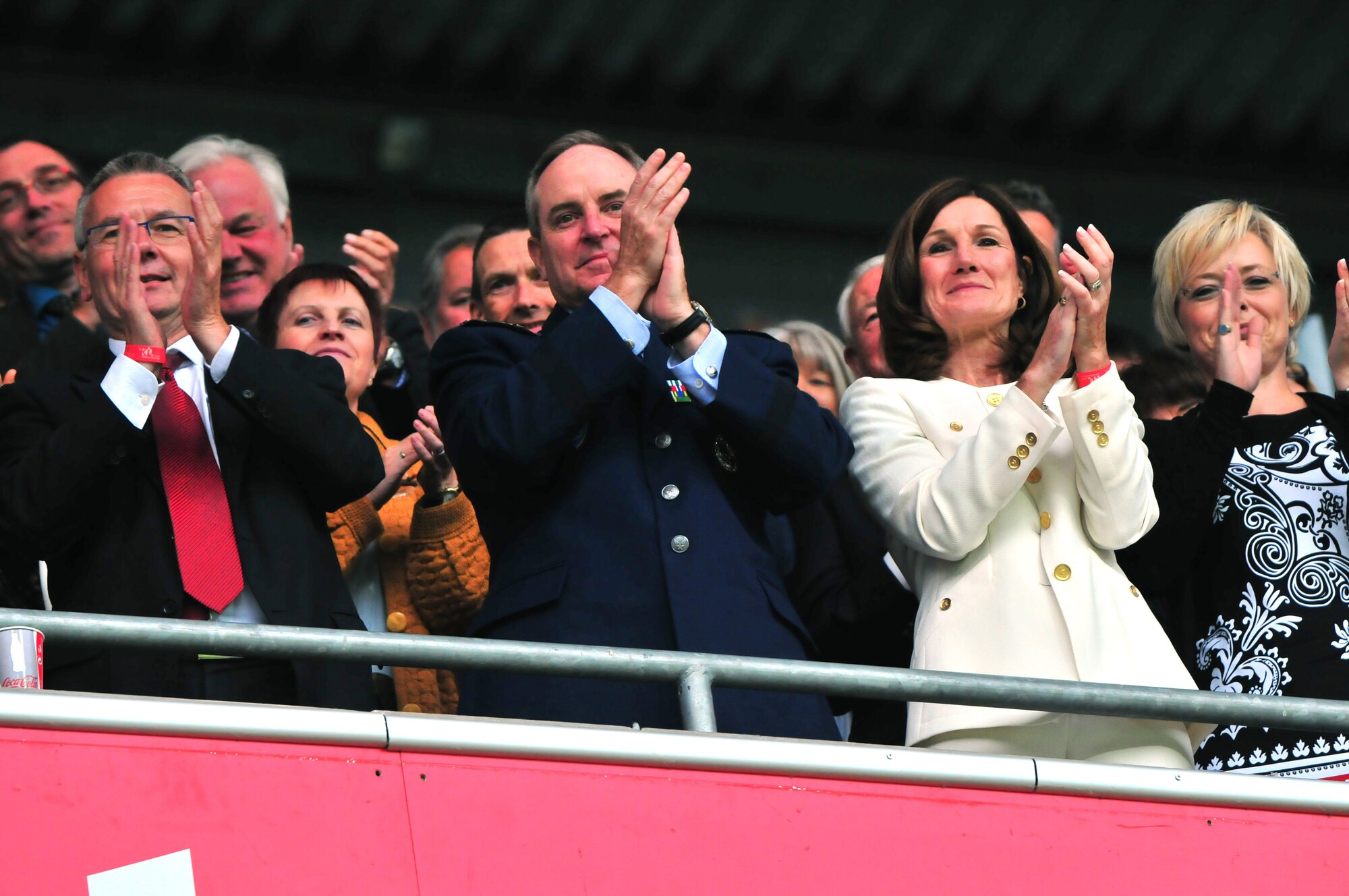 Gen. Mark A. Welsh III, U.S. Air Forces in Europe commander, and his wife Betty, cheer on the bands as they perform during the 22nd Annual NATO Musikfestival, Fritz-Walter Stadion, Kaiserslautern, Germany, June 11, 2011.  Several hundred military musicians and bands from seven different nations performed musical selections influenced by their nation's culture and individual music styles.  (U.S. Air Force Photo by Tech. Sgt. Chenzira Mallory)