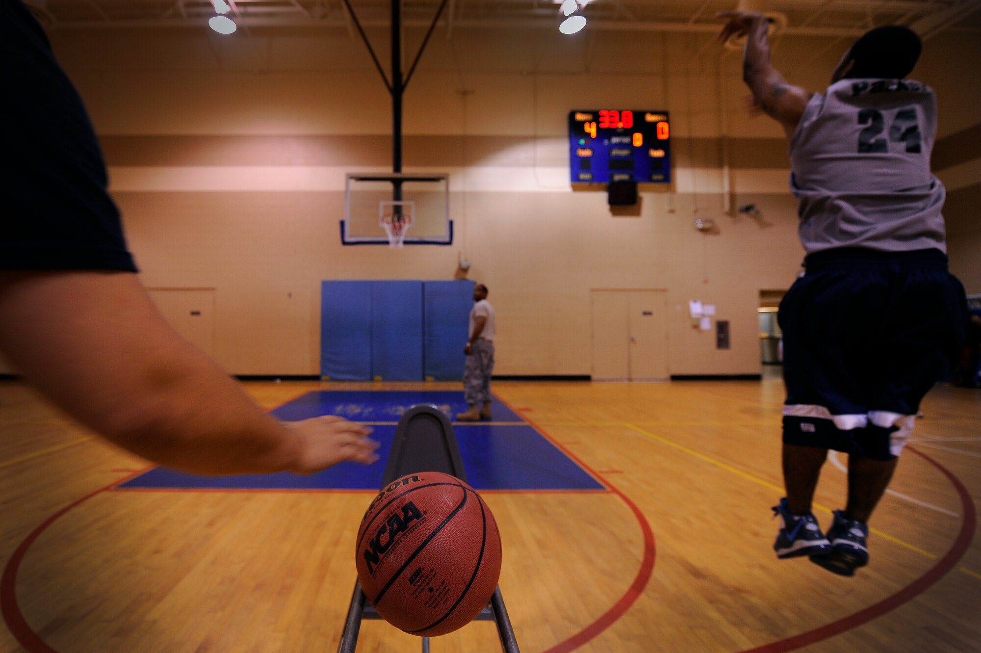 SHAW AIR FOCE BASE S.C. -- Staff Sgt. Sean Parker, 20th Logistic Readiness Squadron, releases a long three-point shot before turning back to grab the last basketball off the rack during a 20th Force Support Squadron three-point shootout June 13, 2011. The shootout brought maximum participation among several squadrons and allowed Airmen and civilian contractors a chance to showcase their shooting skills and compete for a top spot.  (U.S. Air Force photo by Senior Airman Kenny Holston)(Released)
