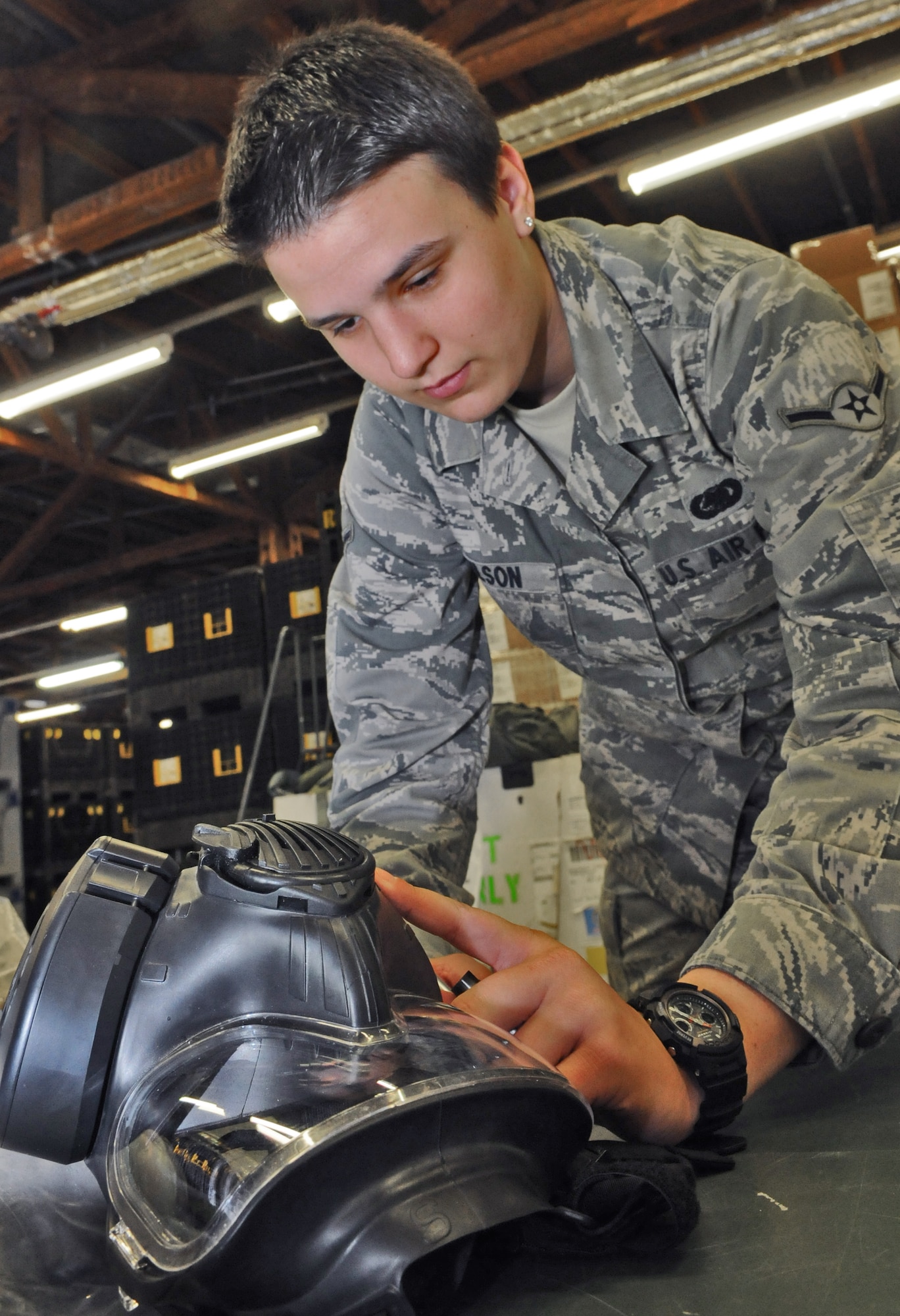 SPANGDAHLEM AIR BASE, Germany – Airman Brooke Wilson, 52nd Logistics Readiness Squadron individual protective equipment apprentice, annotates the serial number of a gas mask during a 100 percent equipment inventory at the mobility warehouse June 7. The inventory was one step of a web migration checklist issued by U.S. Air Forces in Europe will take place July 5-22.. (U.S. Air Force photo/Senior Airman Nick Wilson)