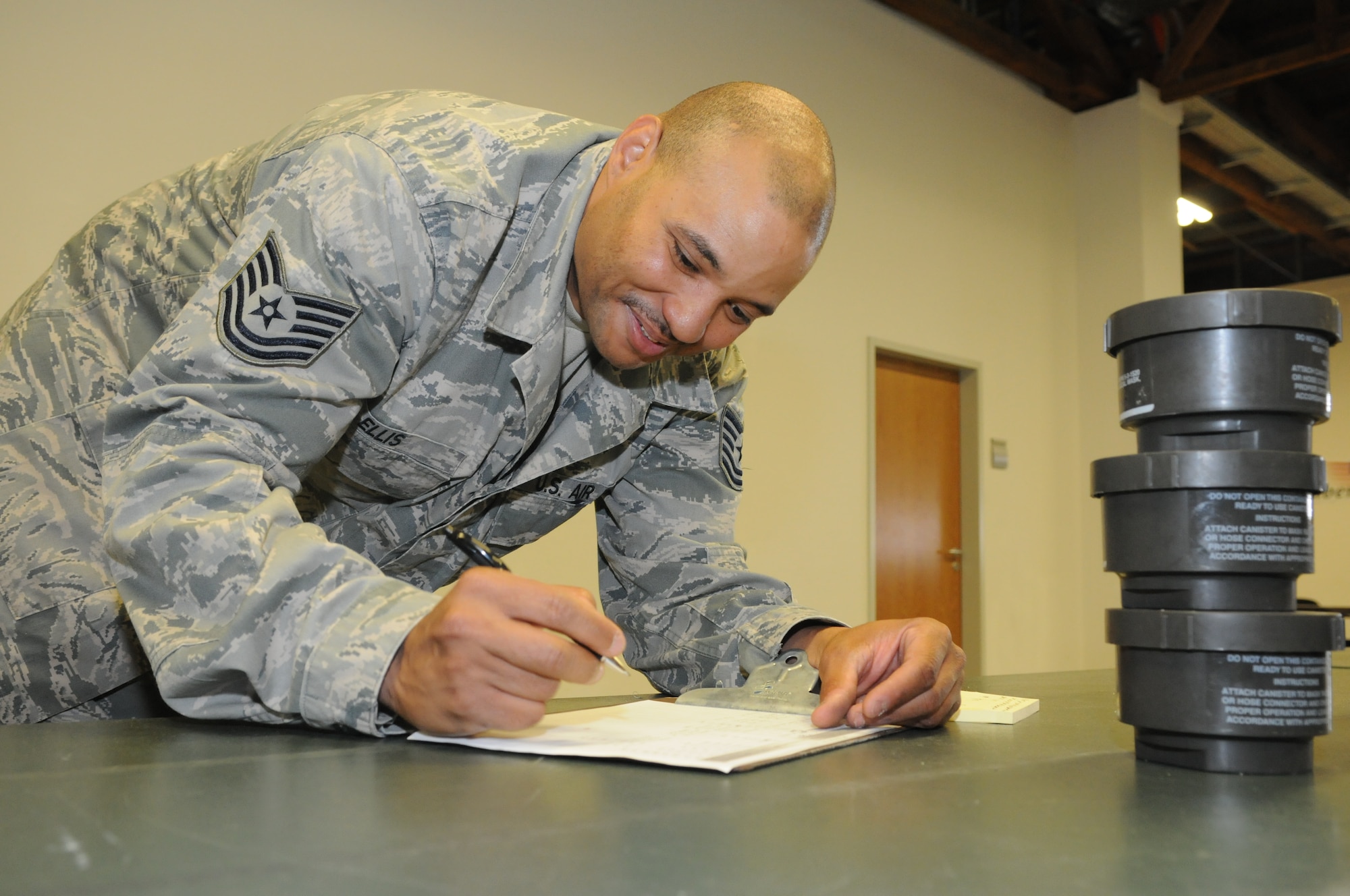 SPANGDAHLEM AIR BASE, Germany – Tech. Sgt. Kenton Ellis, 52nd Logistics Readiness Squadron individual protective equipment NCO in charge, annotates an IPE check sheet during a 100 percent inventory at the IPE warehouse June 7. The inventory was one step of a web migration checklist issued by U.S. Air Forces in Europe that will take place July 5-22.. (U.S. Air Force photo/Senior Airman Nick Wilson)