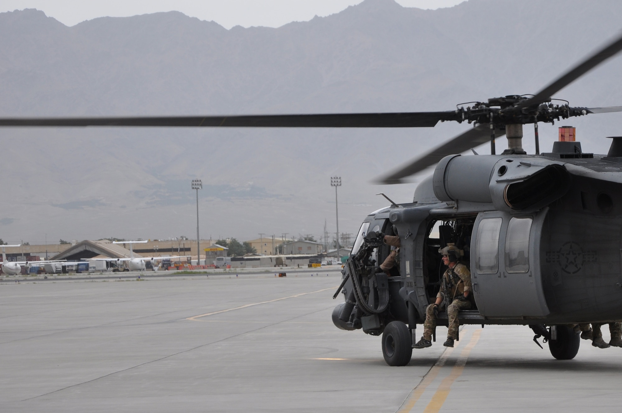 BAGRAM AIRFIELD, Afghanistan -- A HH-60G Pave Hawk helicopter full of pararescue Airmen from the 83rd Expeditionary Rescue Squadron taxies out on a life-saving casualty evacuation mission here June 11. The quick response actions of the 83rd ERQS Airmen saved the lives of two wounded Afghan National Police in Kapisa Province, Afghanistan. It takes the 83rd ERQS an average of just 10 minutes from the time of notification to have a helicopter on its way to the fight. The 83rd ERQS aircrews are deployed from the 33rd Rescue Squadron at Kadena Air Base. The pararescue Airmen are deployed from the 31st Rescue Squadron, also at Kadena Air Base. (U.S. Air Force photo by Staff Sgt. John Wright)