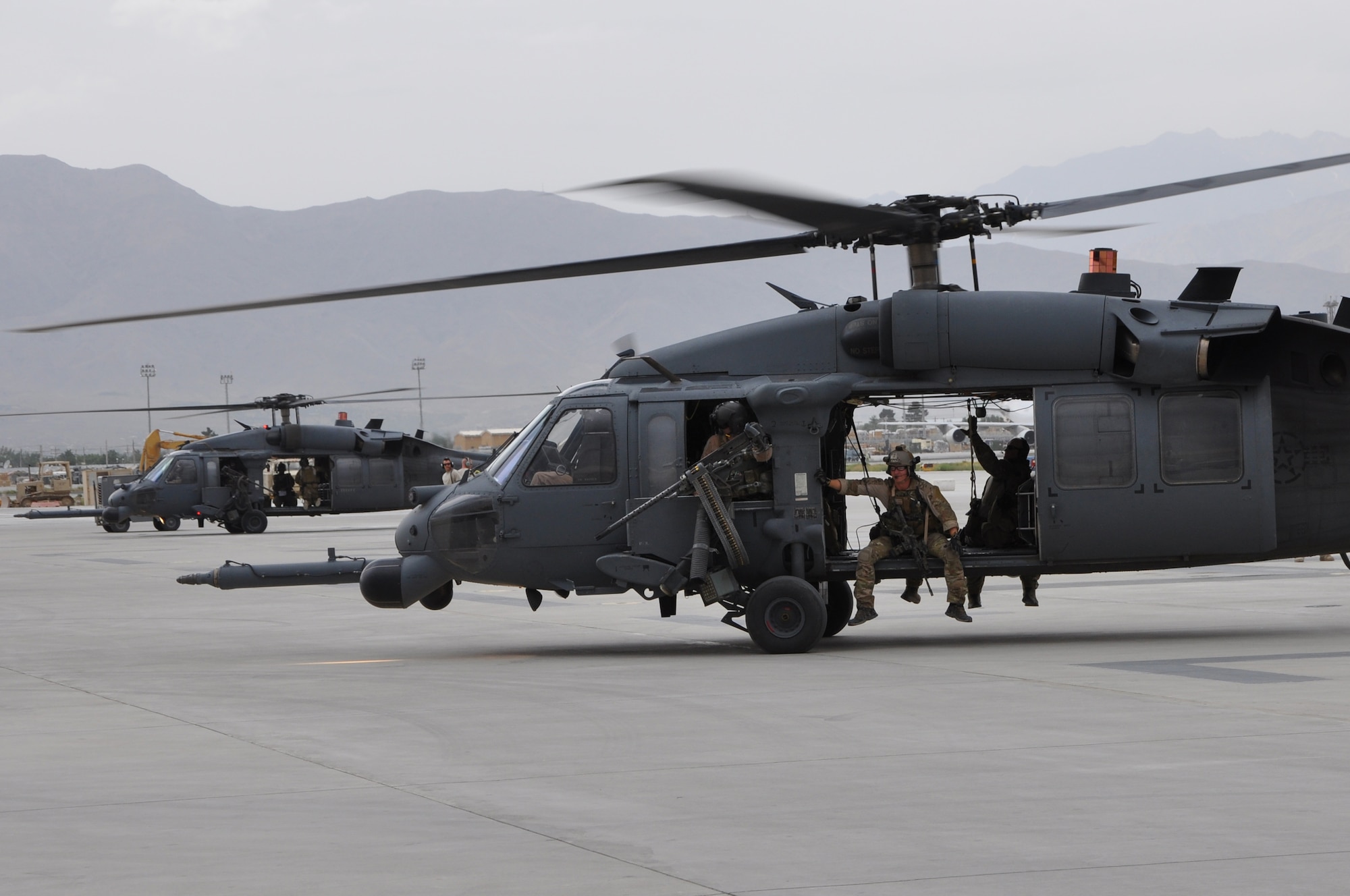 BAGRAM AIRFIELD, Afghanistan -- A HH-60G Pave Hawk helicopter full of pararescue Airmen from the 83rd Expeditionary Rescue Squadron taxies out on a life-saving casualty evacuation mission here June 11. The quick response actions of the 83rd ERQS Airmen saved the lives of two wounded Afghan National Police in Kapisa Province, Afghanistan. It takes the 83rd ERQS an average of just 10 minutes from the time of notification to have a helicopter on its way to the fight. The 83rd ERQS aircrews are deployed from the 33rd Rescue Squadron at Kadena Air Base. The pararescue Airmen are deployed from the 31st Rescue Squadron, also at Kadena Air Base. (U.S. Air Force photo by Staff Sgt. John Wright)