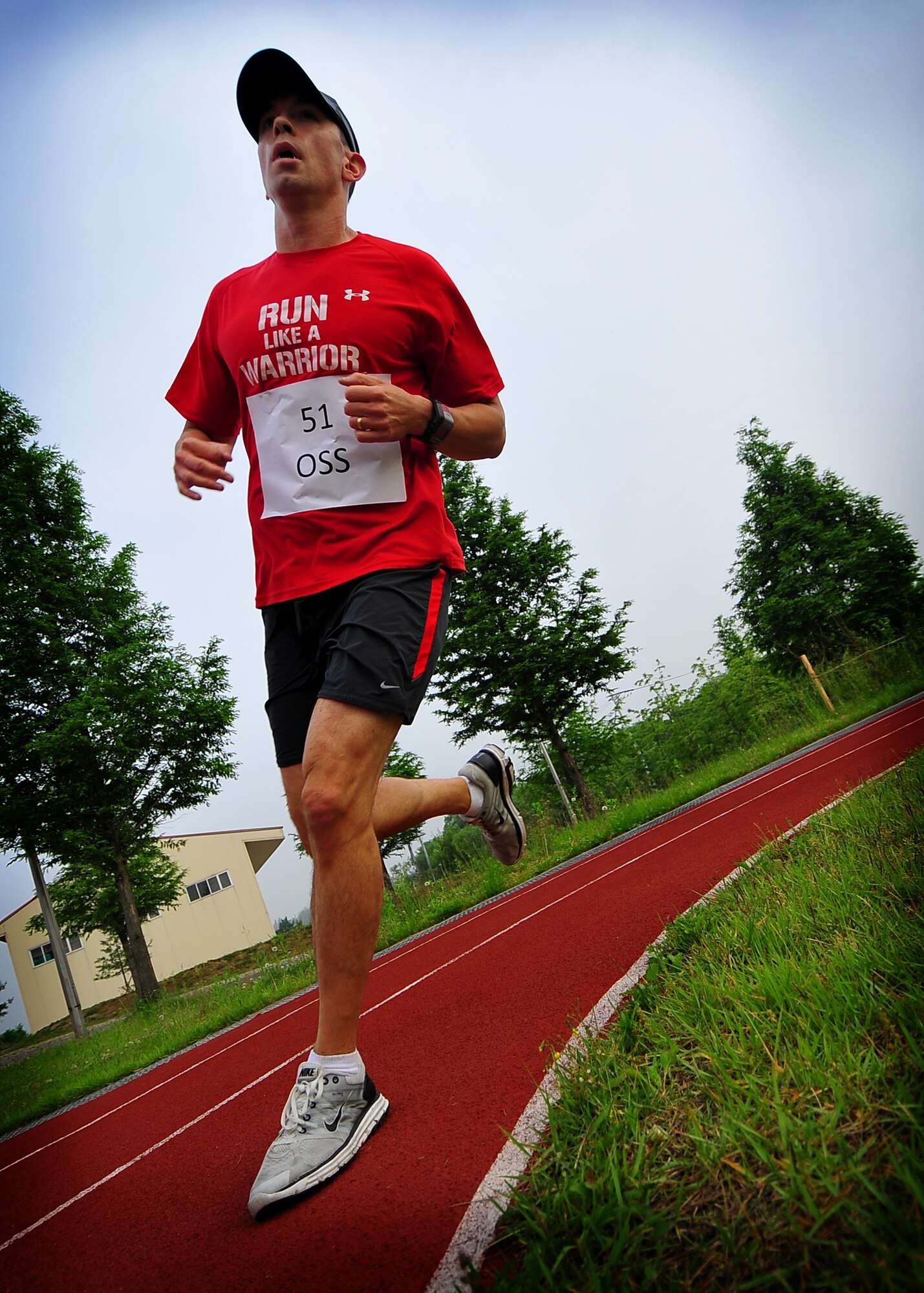 Major Bryan Meek, 51st Wing Safety, runs a lap around the track during the Osan Air Base 10 hour run June 10.  The purpose of the run was to raise money through donations for Japan relief efforts and boost troop morale.  (U.S. Air Force photo/Senior Airman Evelyn Chavez)