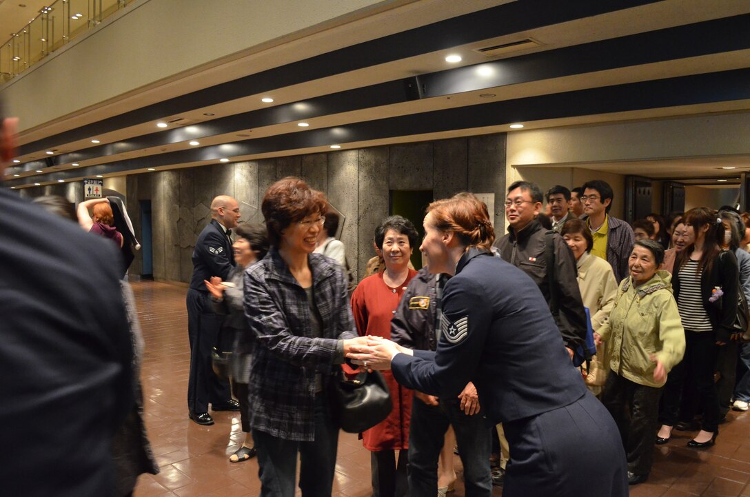 TSgt Rebecca Packard greets audience members after an AF Band of the Pacific-Asia performance in the Sendai area, June 2011.