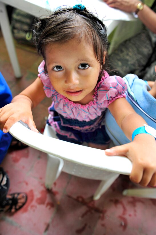 A Colombian child poses for a photo during her pediatric visit at the Escuela Max Seidel medical site during Continuing Promise 2011 in Tumaco, Colombia, June 8, 2011.