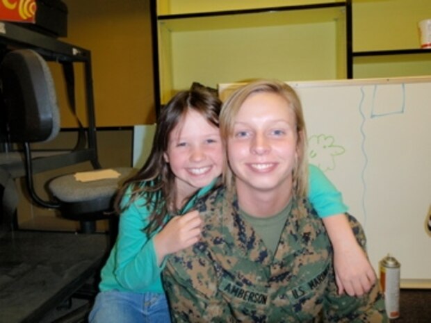 Lance Cpl. Thea Amberson, a big sister with Operation Bigs, poses with her Little Sister Kaitlynn during a session at Mary Fay Elementary School. Volunteers meet on a consistent basis with their mentees to foster quality one-on-one friendships.