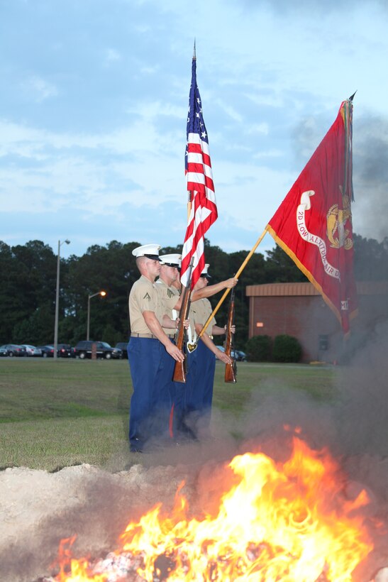 Marines from 2nd Low Altitude Air Defense Battalion present the colors during the playing of the national anthem at a Flag Disposal Ceremony outside of Battery A at Marine Corps Air Station Cherry Point June 14.