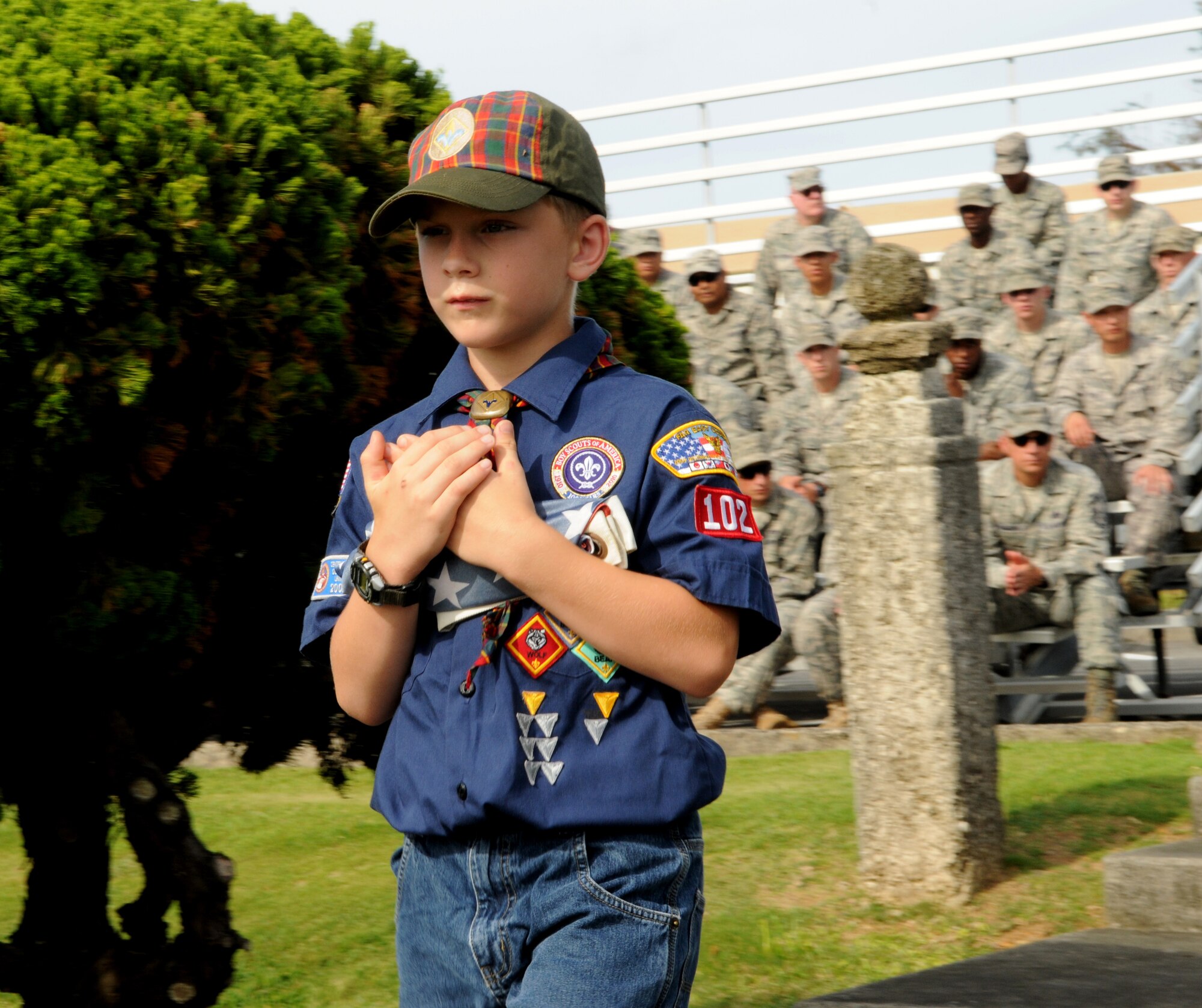 A Local Cub Scout prepares his flag for retirement during the 2011 Air Force Sergeants Association’s Flag Day Ceremony, June 14, Kadena Air Base, Japan. During this ceremony, unserviceable flags were retired honorably by being burned. (U.S. Air Force photo/ Airman 1st Class Jarvie Z. Wallace) 