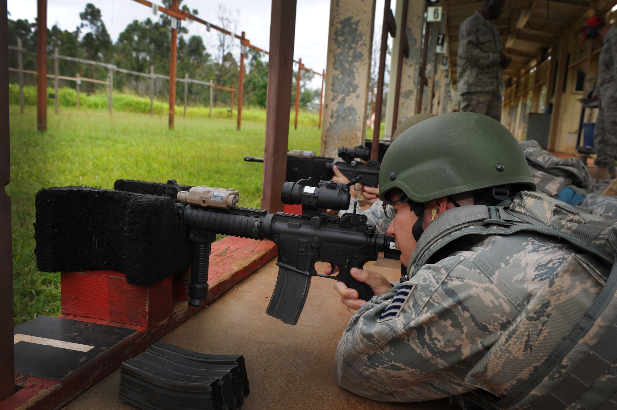 Tech. Sgt. Michael Skonetski, 647th Security Forces Squadron Rodeo team leader, prepares to fire his M4 rifle on the firing range at Scholfield Barracks June 13 in preparation for the upcoming Rodeo competition in July. The 647th SFS Rodeo team consists of four members who must endure physical and mental challenges to ready themselves for the competition. (U.S. Air Force photo/Senior Airman Lauren Main)