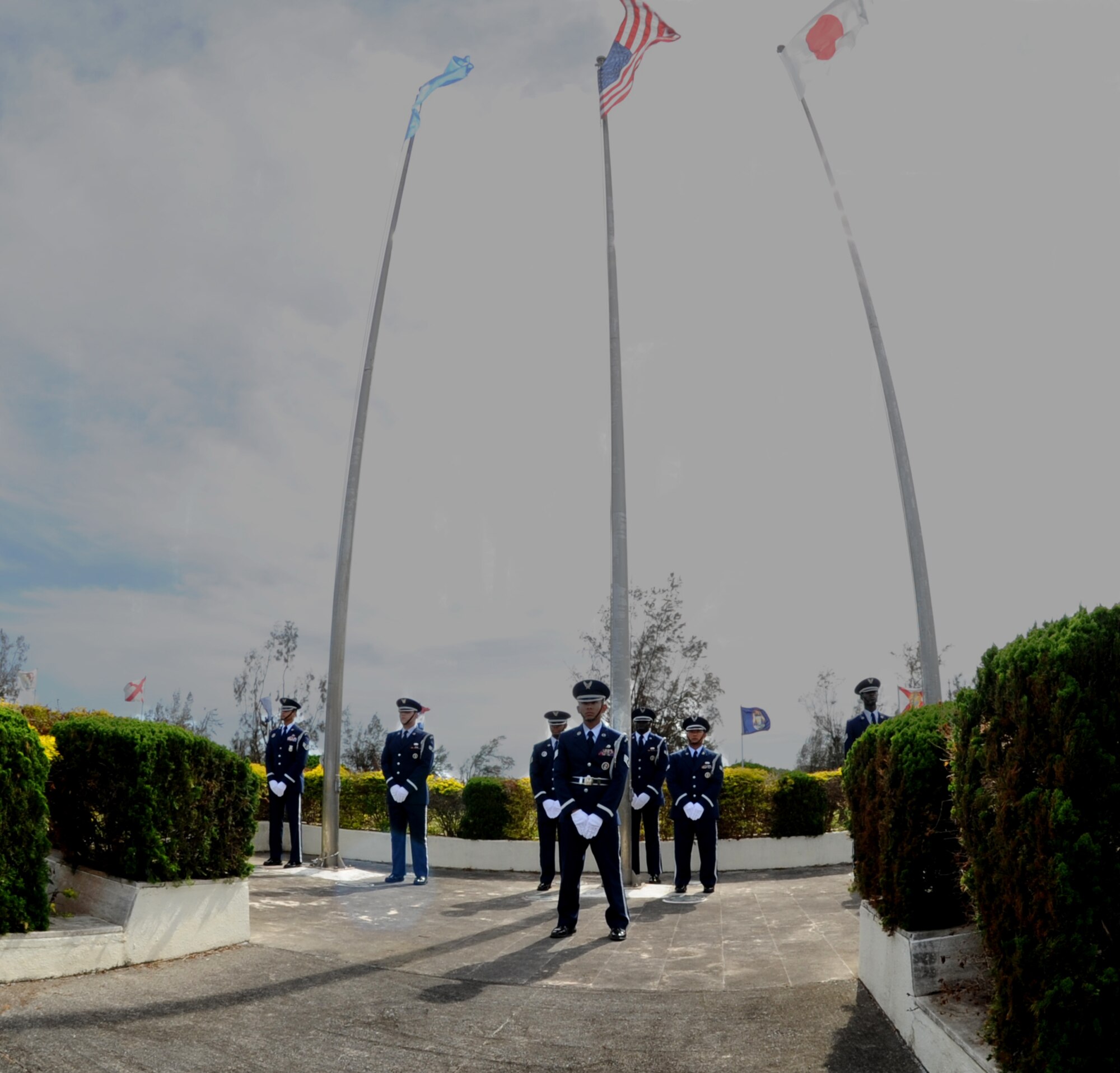 Kadena Honor Guard members prepare for retreat during the 2011 Air Force Sergeants Association’s Flag Day Ceremony, June 14, Kadena Air Base, Japan. During this ceremony, unserviceable flags were retired honorably by being burned. (U.S. Air Force photo/Airman 1st Class Jarvie Z. Wallace)
