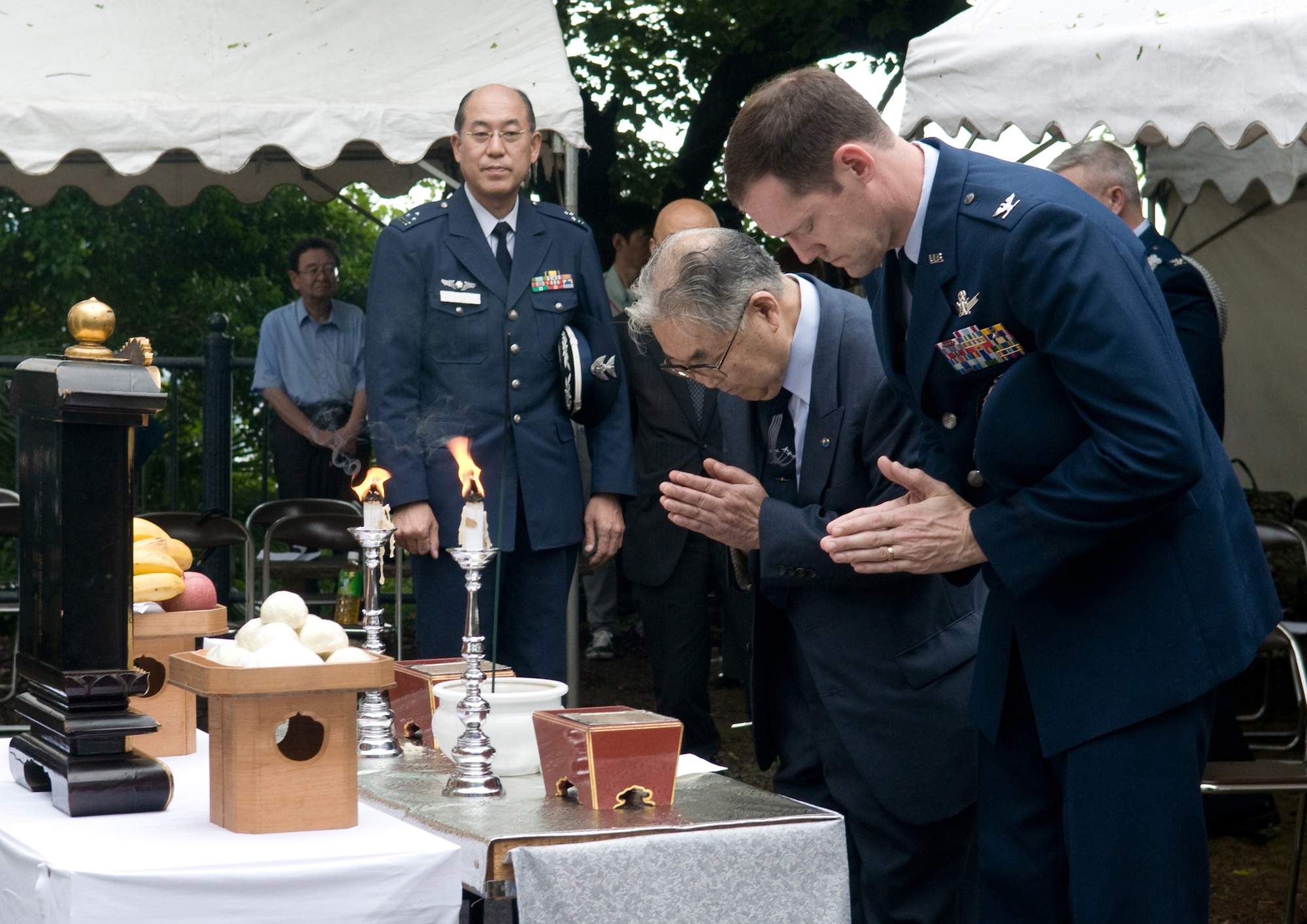 Col. Todd Freece (right), and Dr. Hiroya Sugano participate in a World War II memorial ceremony June 11, 2011, in Shizuoka City, Japan. U.S. Airmen have been invited to take part in the event each year since 1972, bringing the U.S. and Japanese communities together to mourn a shared loss. Colonel Freece is the commander of the 374th Mission Support Group at Yokota Air Base, Japan. Dr. Sugano is the host of the annual ceremony. (U.S. Air Force photo/Airman John D. Partlow)