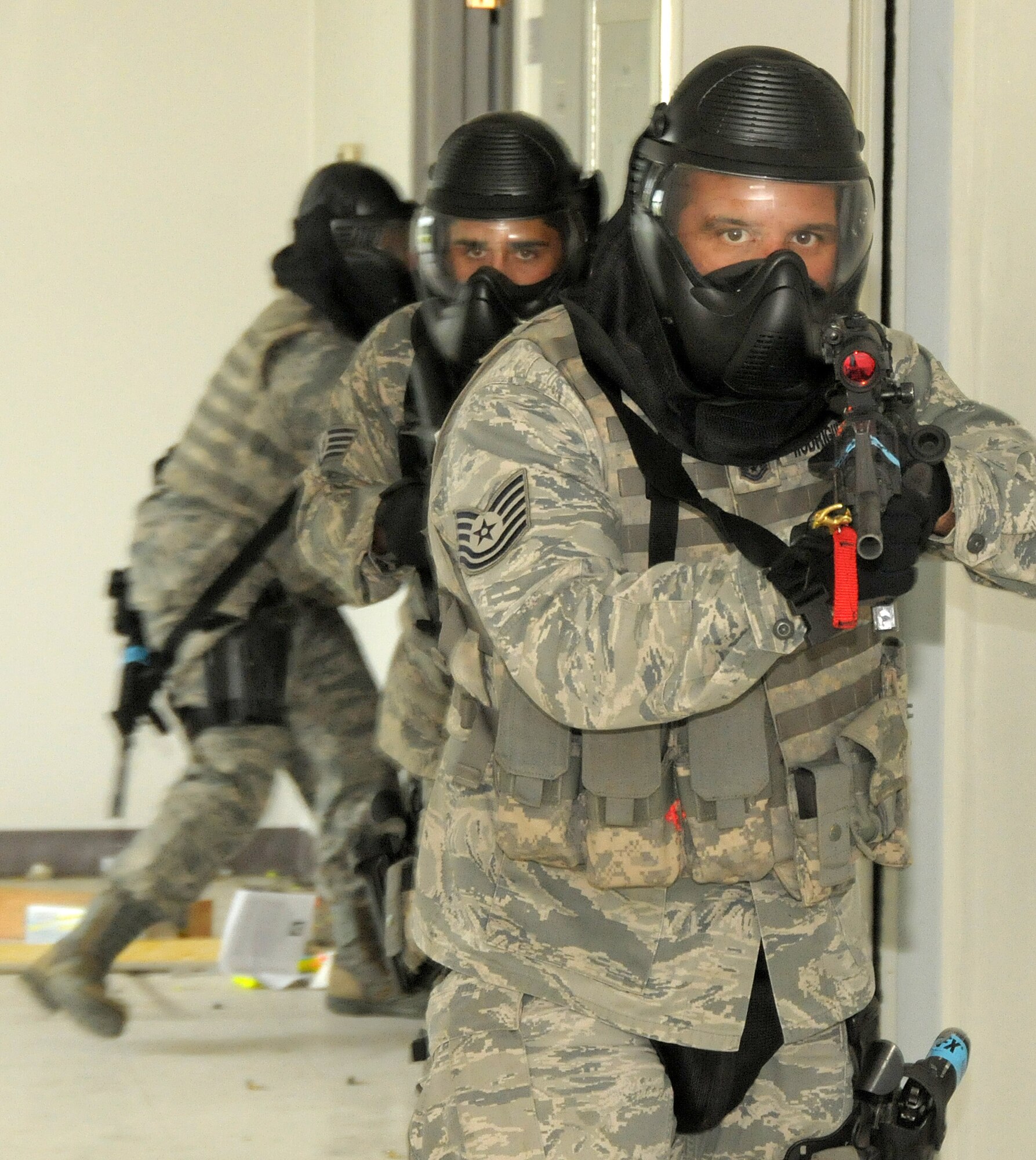 Members of the Security Forces Squadron from the 146th Airlift Wing, Channel Islands Air National Guard Station, Calif. participate in an active shooter training scenario conducted by the 176th Air Wing Security Forces Squadron, Alaska Air National Guard, Joint Base Elmendorf- Richardson, Anchorage, Alaska on June 13, 2011.  Photo by Tech. Sgt. Alex Koenig