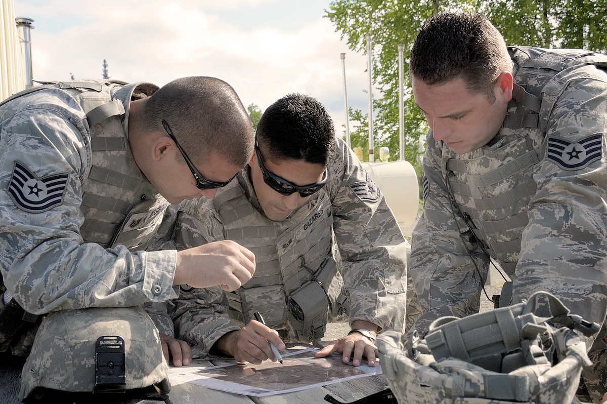 Members of the 146th Airlift Wing's Security Forces Squadron participate in a land navigation course at Joint Base Elmendorf-Richardson, Anchorage, Alaska on June 9, 2011. The 146th AW, Channel Islands Air National Guard Station, Calif. sent three squadrons to JBER from June 4 to June 18, 2011. The Air Terminal Operations Squadron, Logistics Readiness Squadron, and the Security Forces Squadron moved down range to complete their respective annual training requirements. Photo by Tech. Sgt. Alex Koenig