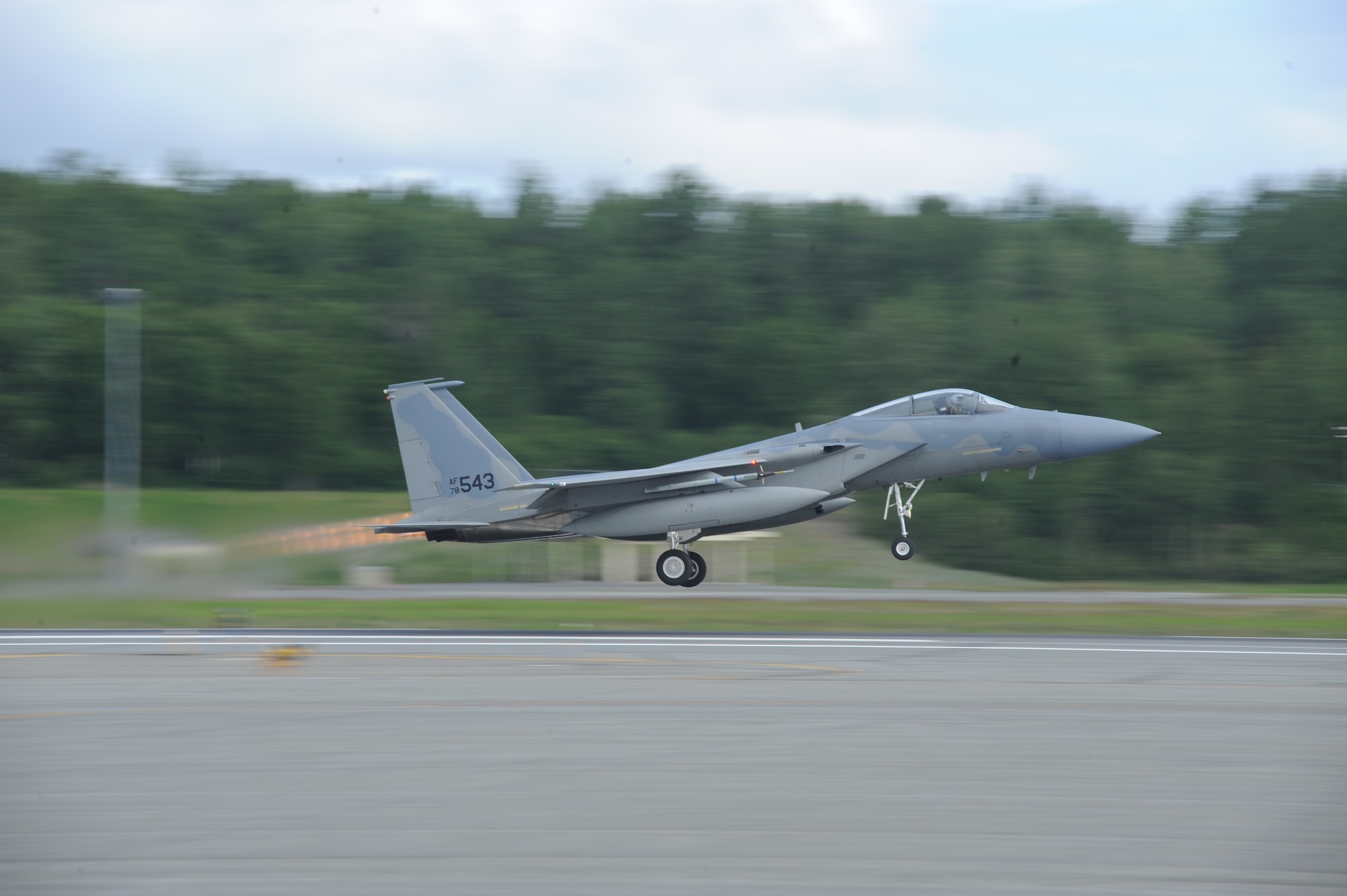 JOINT BASE ELMENDORF RICHARDSON, Alaska --  An F-15 Eagle takes off to participate in the first training mission of Operation Northern Edge 11 in JBER, Alaska, June 13, 2011. Northern Edge, Alaska's largest military training exercise, is designed to prepare joint forces to respond to crises throughout the Asia-Pacific region. (Photo by Mass Communication Specialist 2nd Class Rufus Hucks)