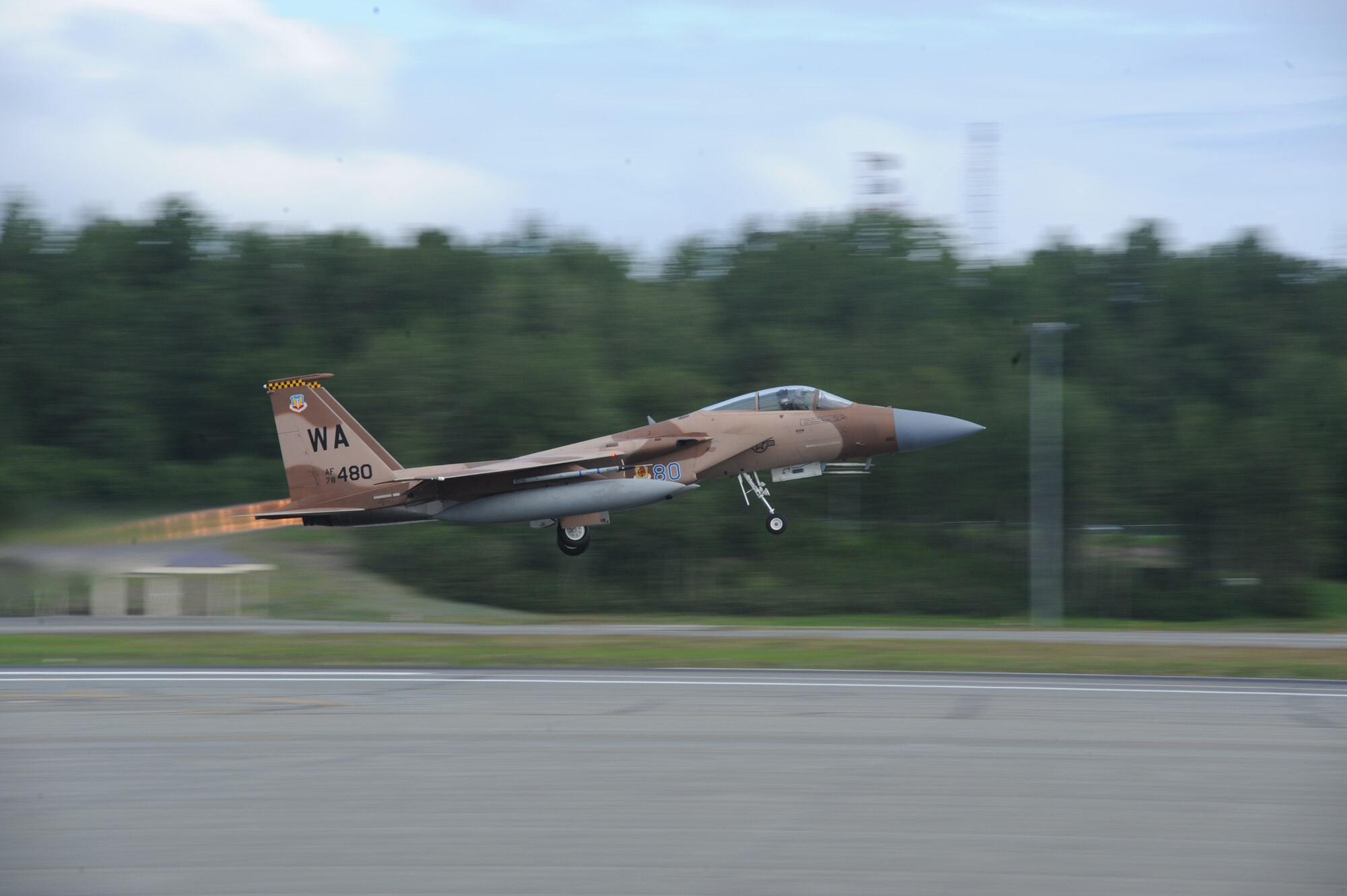 JOINT BASE ELMENDORF RICHARDSON, Alaska --  An F-15 Eagle from the 65th Aggressor Squadron at Nellis Air Force Base, Nev., takes off to participate in the first training mission of Operation Northern Edge 11 in JBER, Alaska, June 13, 2011. Northern Edge, Alaska's largest military training exercise, is designed to prepare joint forces to respond to crises throughout the Asia-Pacific region. (Photo by Mass Communication Specialist 2nd Class Rufus Hucks)