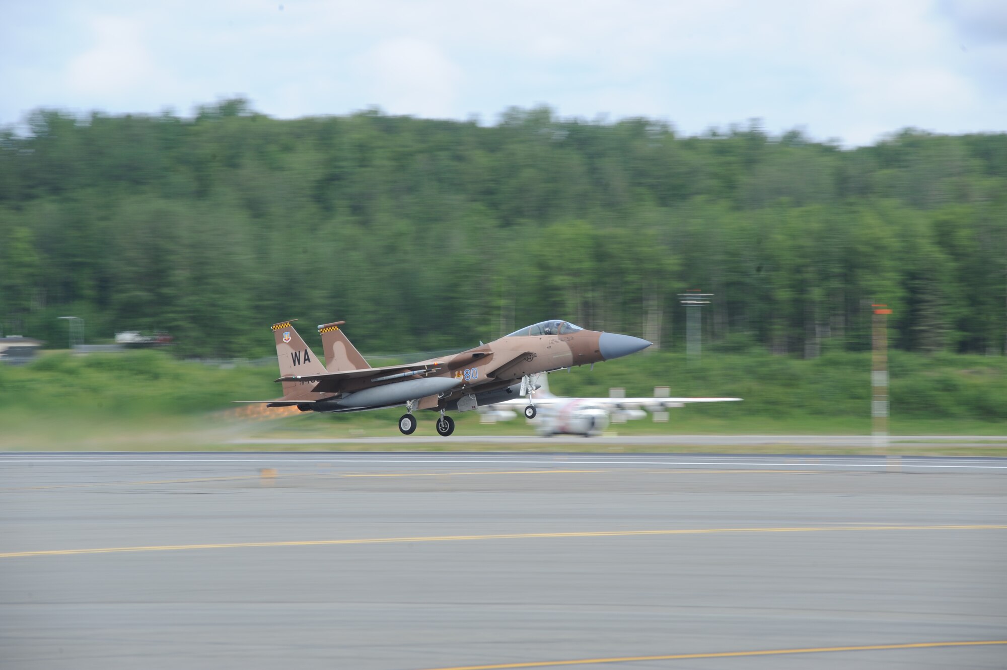 JOINT BASE ELMENDORF RICHARDSON, Alaska --  An F-15 Eagle from the 65th Aggressor Squadron at Nellis Air Force Base, Nev., takes off to participate in the first training mission of Operation Northern Edge 11 in JBER, Alaska, June 13, 2011. Northern Edge, Alaska's largest military training exercise, is designed to prepare joint forces to respond to crises throughout the Asia-Pacific region. (Photo by Mass Communication Specialist 2nd Class Rufus Hucks)