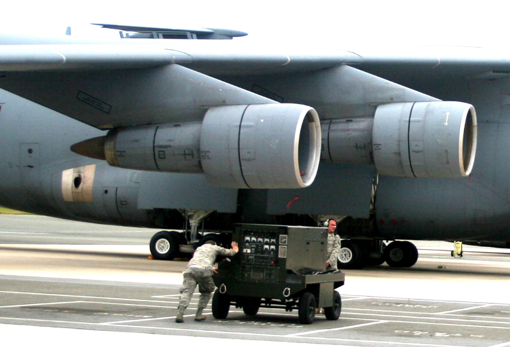 Airmen from the 436th Aircraft Maintenance Squadron work on the flightline at Dover Air Force Base, Del., while preparing a C-5M Super Galaxy for a mission June 5, 2011. The work was done prior to the plane's departure for a direct delivery airlift mission through the Arctic Circle from Dover Air Force Base, Del., to Bagram Airfield, Afghanistan. (U.S. Air Force Photo/Master Sgt. Scott T. Sturkol)